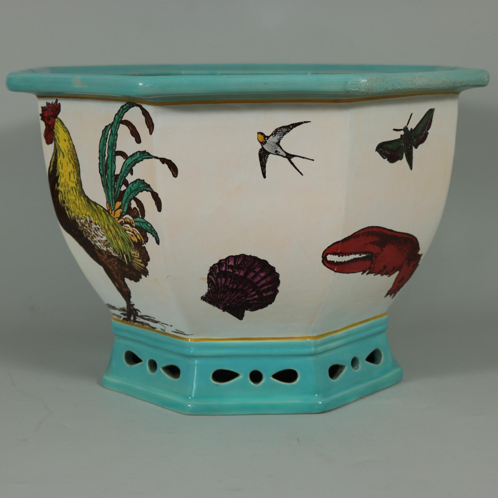Minton Majolica jardinière which features illustrated flora and fauna, including: a cockerel, a kingfisher (bird), a flowering magnolia, a lobster claw, swallows, a bee, insects and flowers. Artist and designer, William Stephen Coleman, was paid