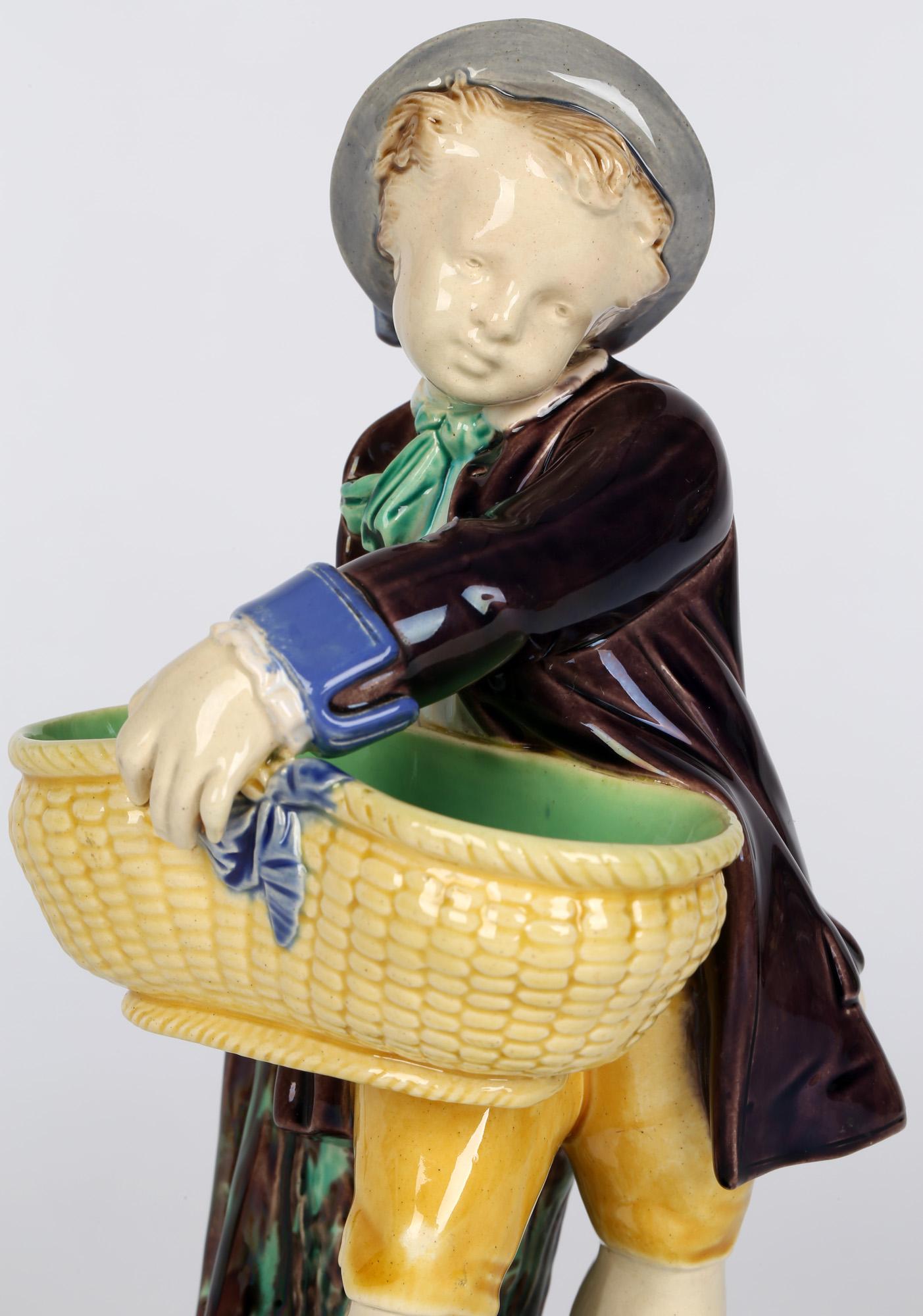 Late 19th Century Minton Majolica Pottery Boy Holding a Basket Probably for Salt For Sale