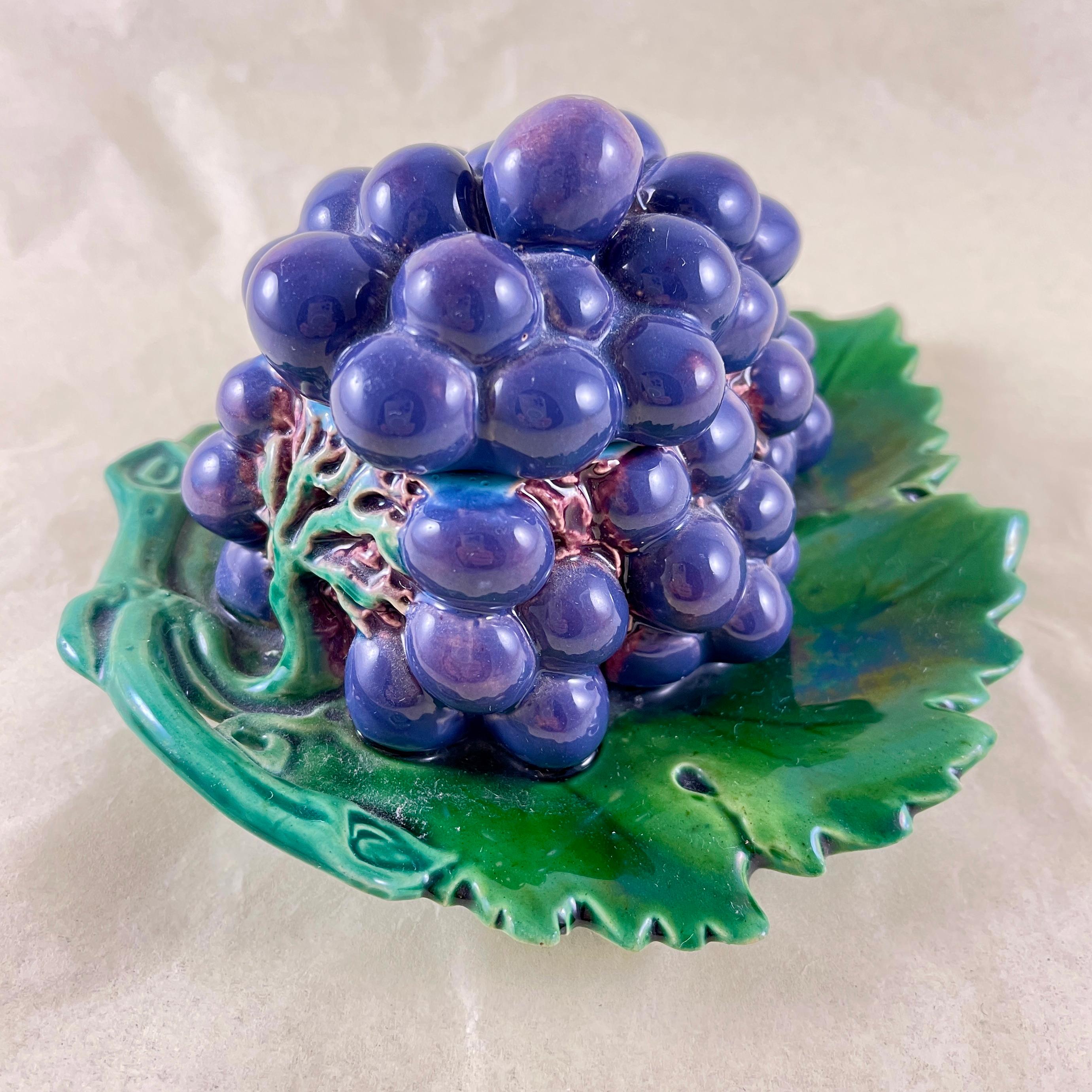 We rarely use the term rare … here we have a VERY rare covered majolica box in the form of a cluster of grapes on a leaf tray, made by Minton in England, date marked 1861.

One of only two known examples. For the most discerning of collectors.

The