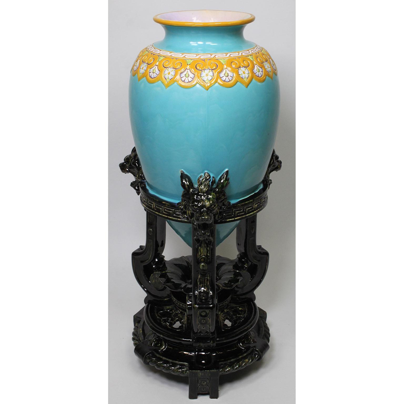 A large and Impressive English Mintons majolica turquoise-ground 'Chinese' celadon vase, design attributed to Christopher dresser, date code for year 1875. The tall vase with a flared yellow mouth, the neck decorated with a yellow and white floral