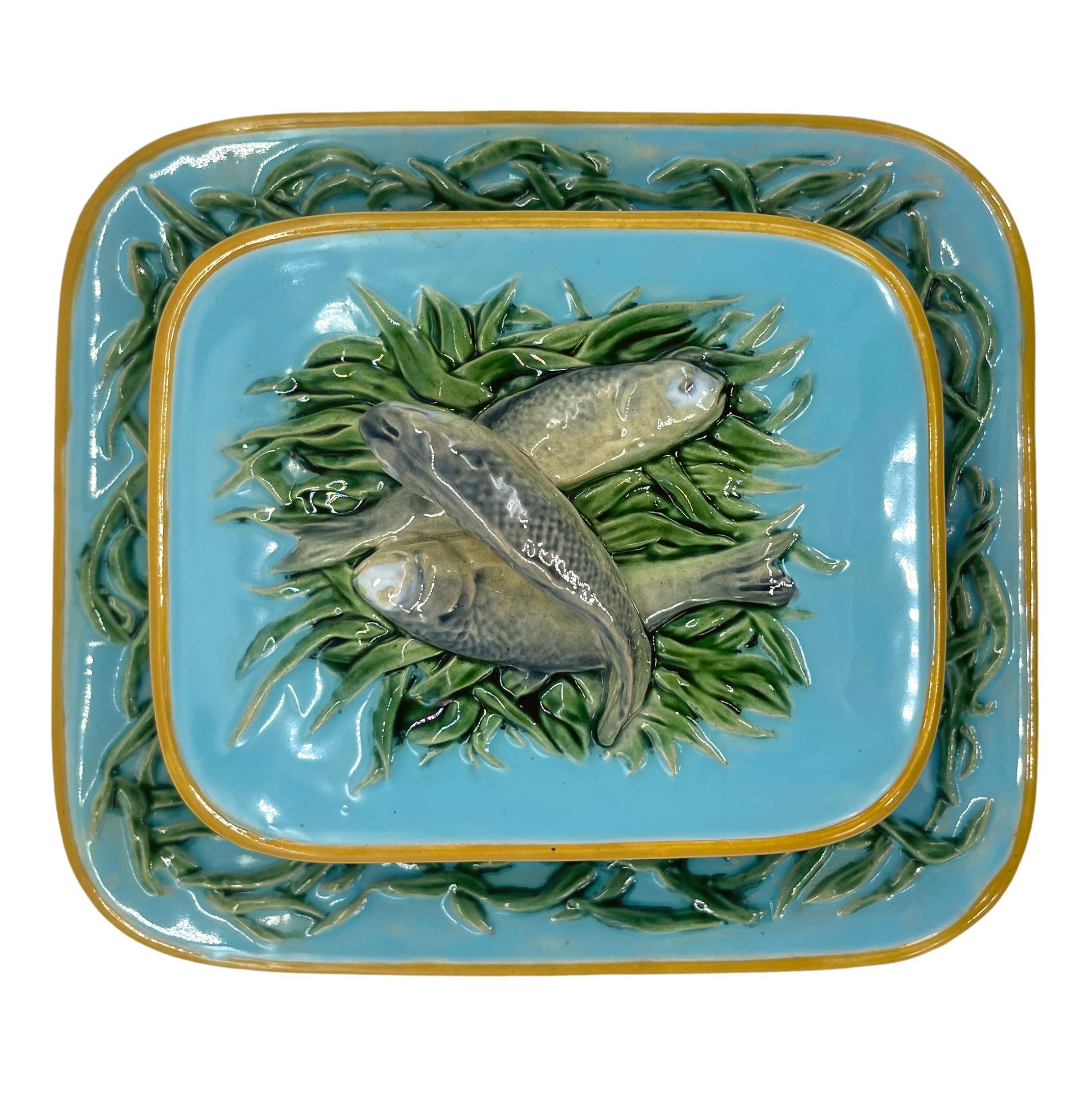 Minton Majolica Sardine Server, the box with integral stand banded with green-glazed seaweed, the lid with three naturalistically glazed sardines on a bed of seaweed, the reverse with impressed marks: 'MINTONS,' with date cypher for 1876, and design