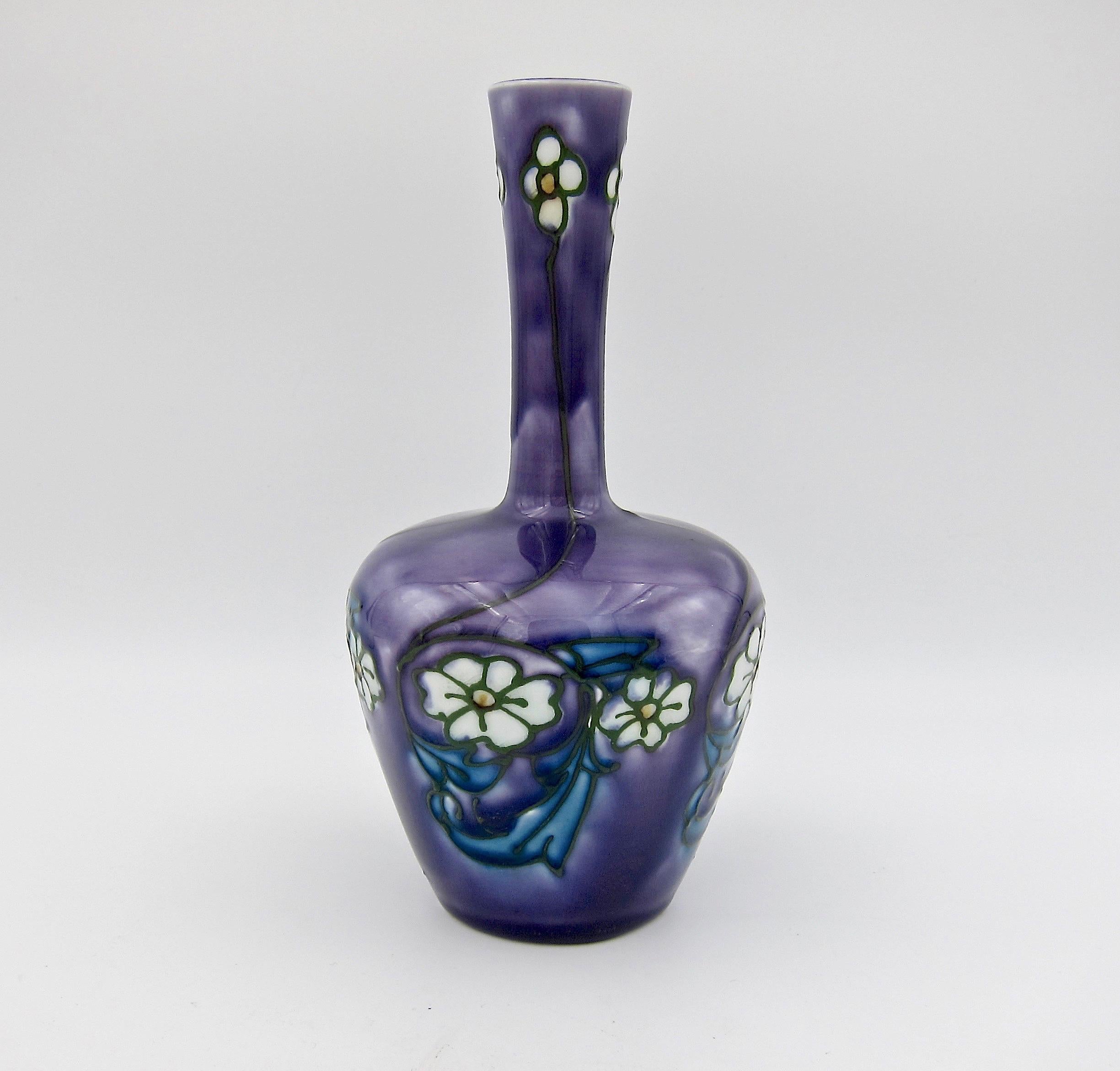 A Minton secessionist ware vase made circa 1910 at Stoke-on-Trent in Staffordshire, England. Mintons produced these designs by Léon V. Solon (1873-1957) and John W. Wadsworth (1879-1955) from circa 1901 through 1920.

This art pottery bottle form