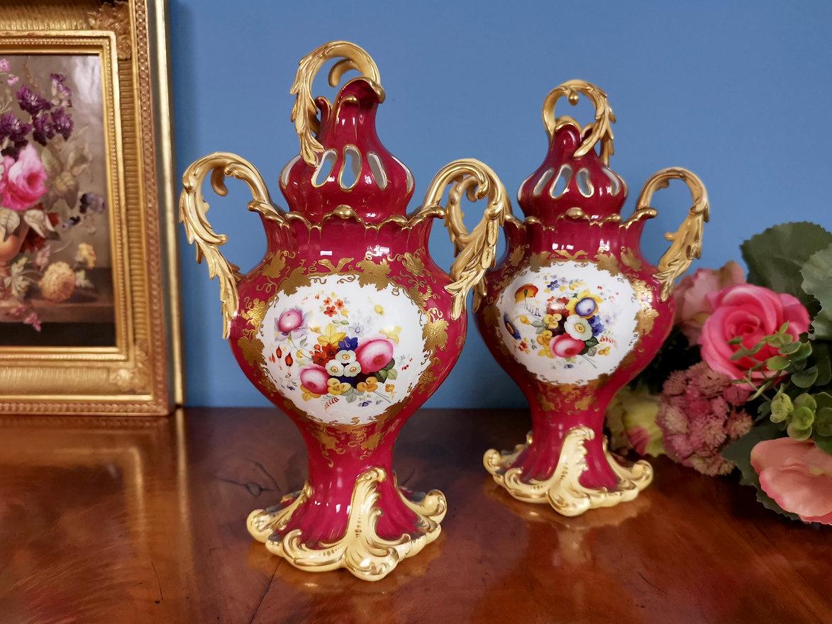 On offer is a stunning pair of potpourri vases with covers made by H&R Daniel in about 1840. The vases are in the Rococo Revival style, and have a deep maroon ground and reserves with flowers on the one side and birds on the other.

If you thought
