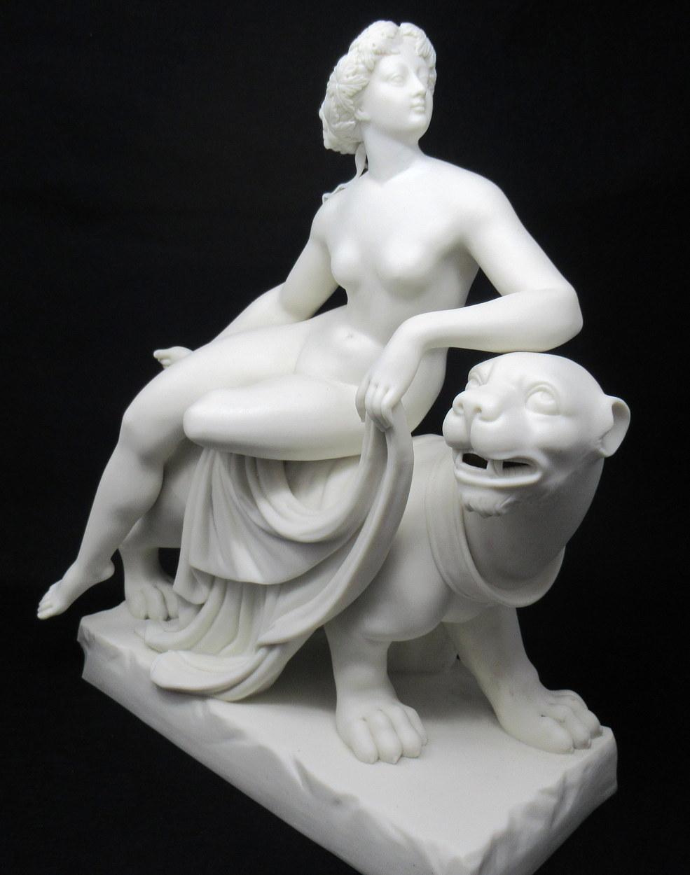 Fine Parian-ware figure of Ariadne Reclining female nude on the back of a stylised standing Panther, wearing an Acanthus wreath on her head, her left leg tucked beneath her right. Holding drapery in her left hand, on a rectangular base, mid-19th