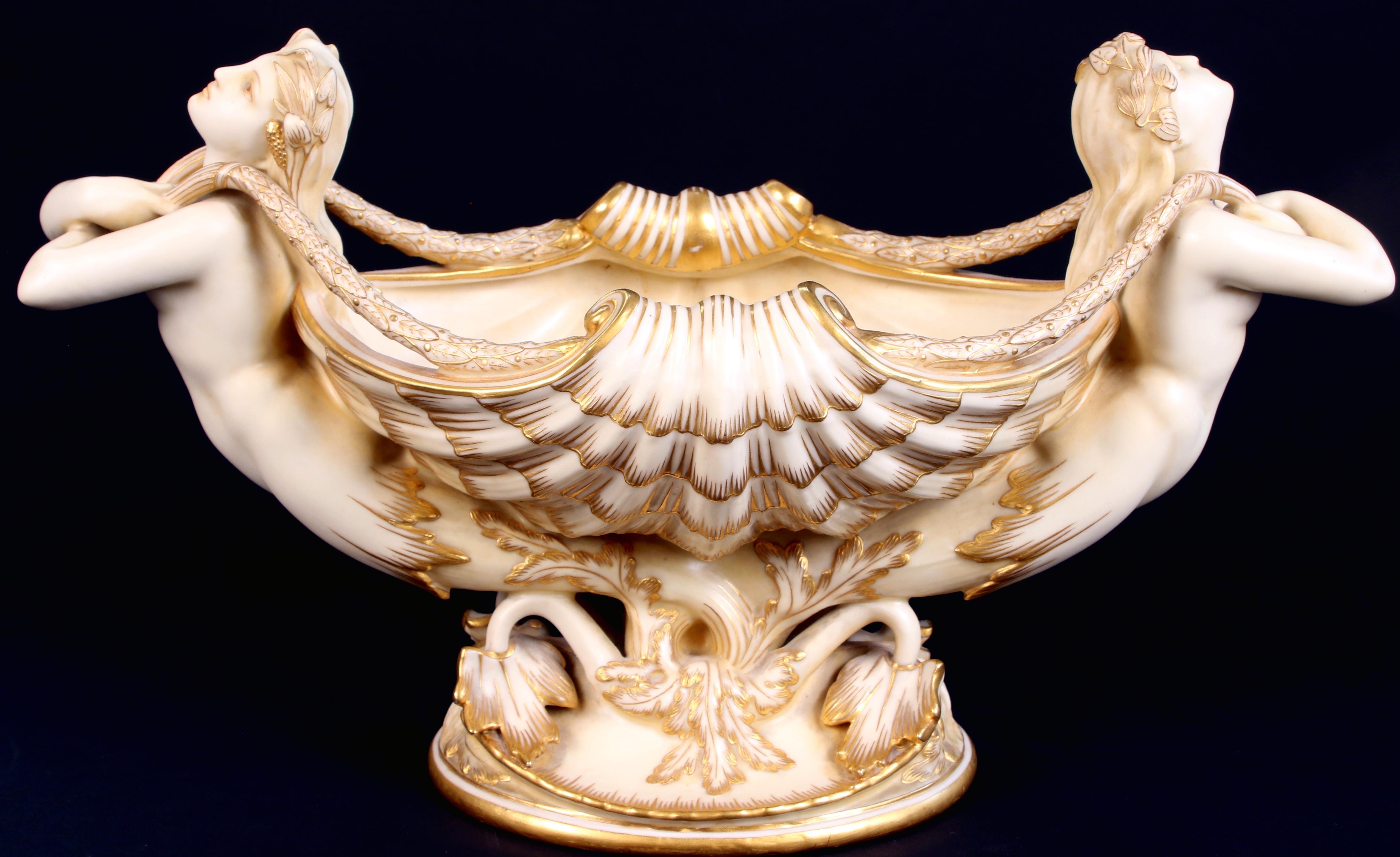 19th century Minton jardinere features a scallop shell supported by two elegant mermaids with lily-pod decorated hair that flows into the bowl. Made of parian, Minton's version of statuary porcelain, that Minton developed in 1846. The mermaids