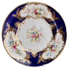 Assiette en porcelaine de Minton, bleu cobalt avec réserves florales, époque victorienne, vers 1840