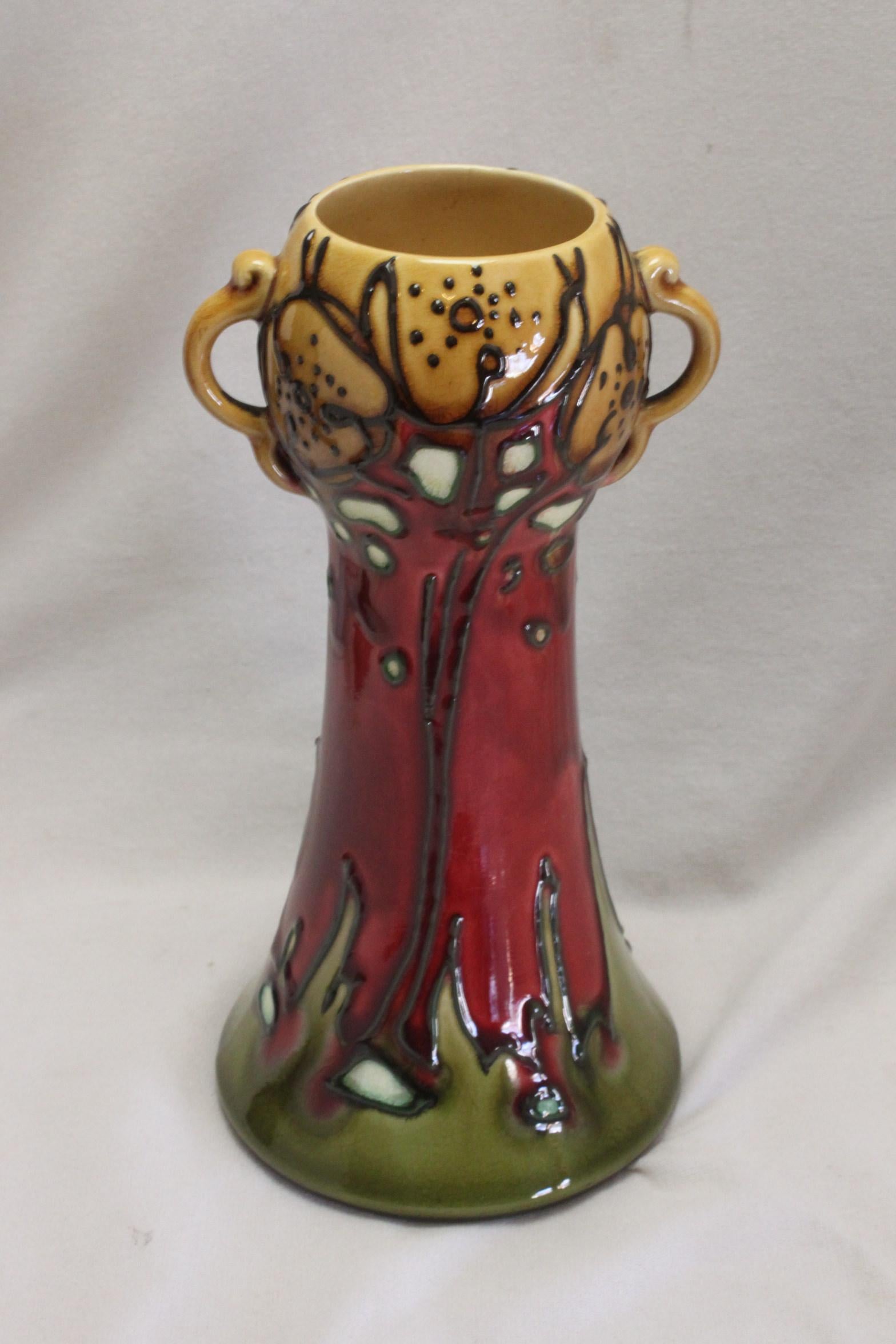 This Minton Secessionist ware vase stands 176 mm (7 inches) high, and has a diameter at the base of 90 mm (3.5 inches). This design is illustrated in the Minton Seccessionist catalogue of 1902 as vase number 41. Designed by John Wadsworth and Leon