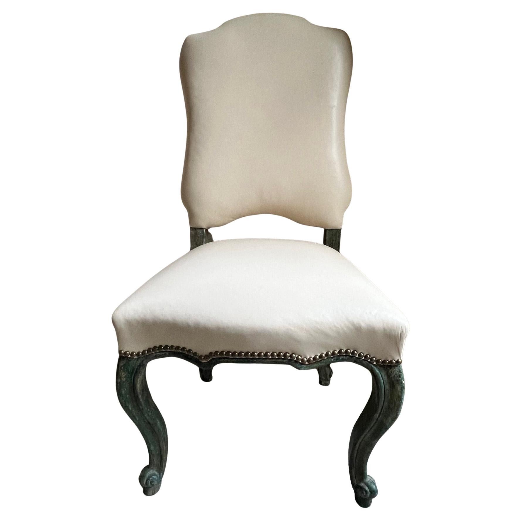 Custom fine reproduction of an 18th century chair, one of a kind, and hand crafted. The distressed finish is called Jade Apple, and the seat and back are covered in leather, has springs and brass tacks.   Please note the indention of the leather in