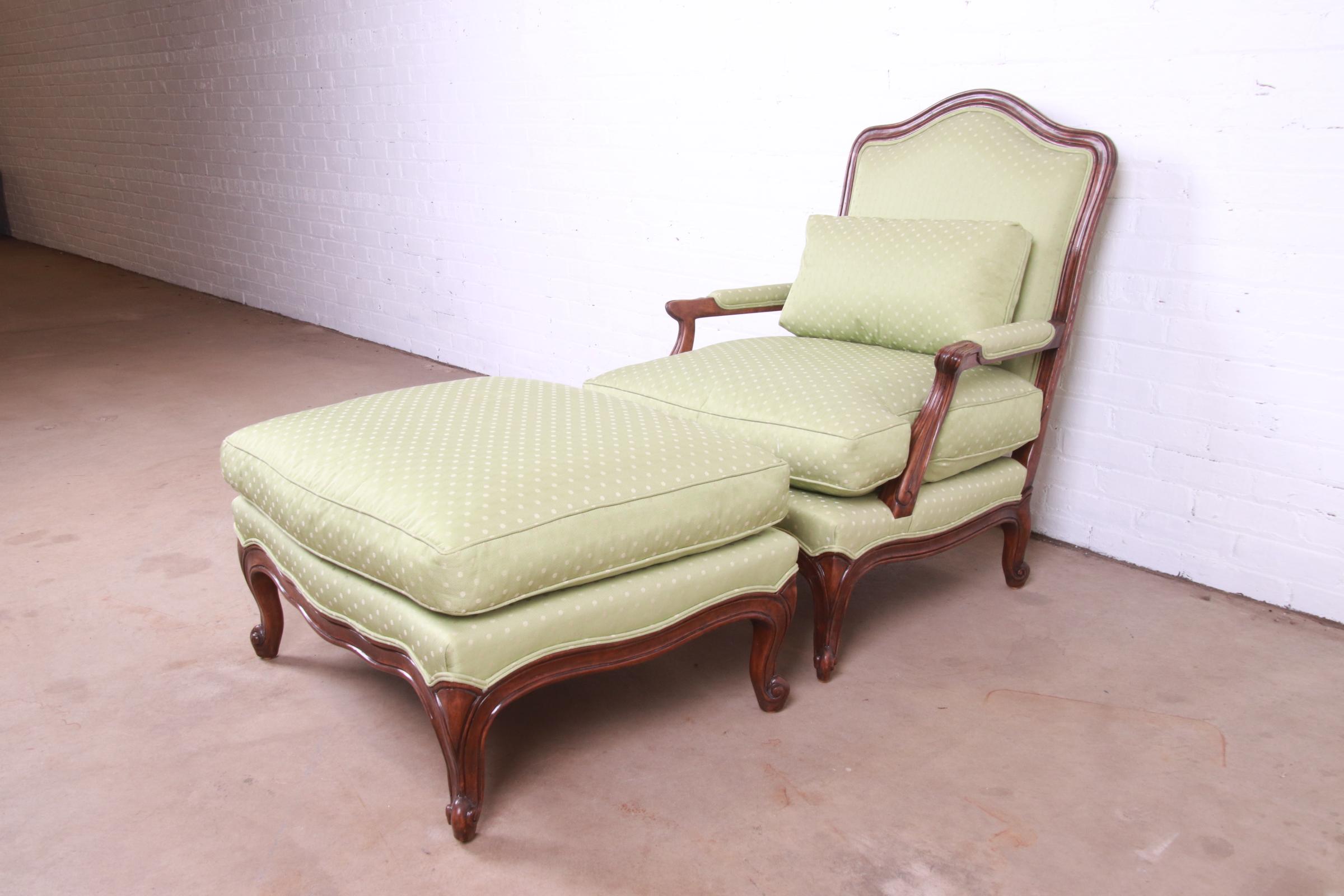 Minton-Spidell French Provincial Carved Walnut Upholstered Fauteuil with Ottoman In Good Condition For Sale In South Bend, IN