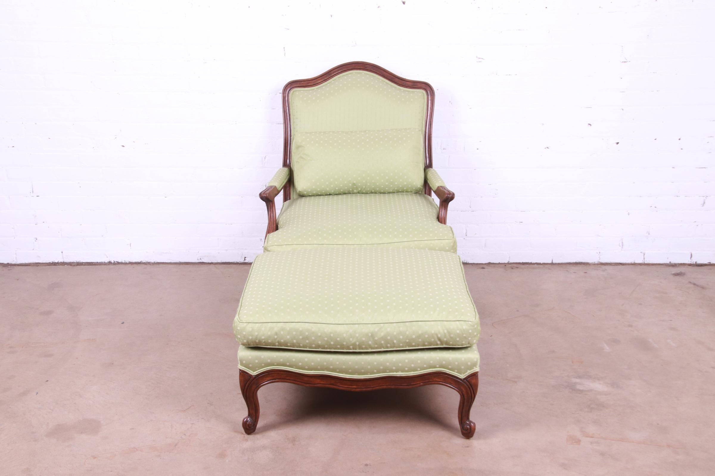 Upholstery Minton-Spidell French Provincial Carved Walnut Upholstered Fauteuil with Ottoman For Sale
