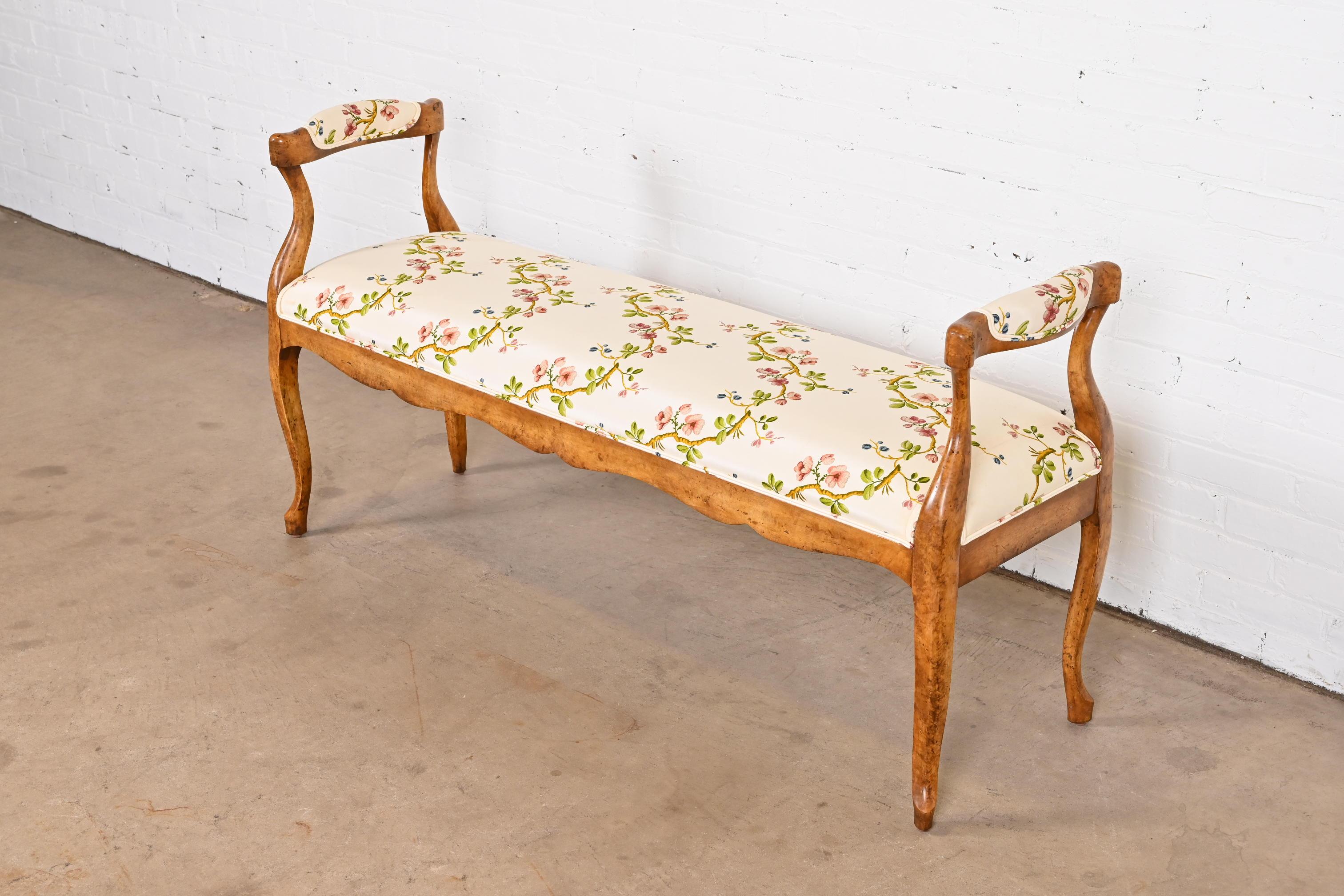 A gorgeous French Provincial style upholstered window bench or bed bench

By Minton Spidell, 20th century

Maple frame and cabriole legs, with a floral and ivory upholstery.

Measures: 58.5