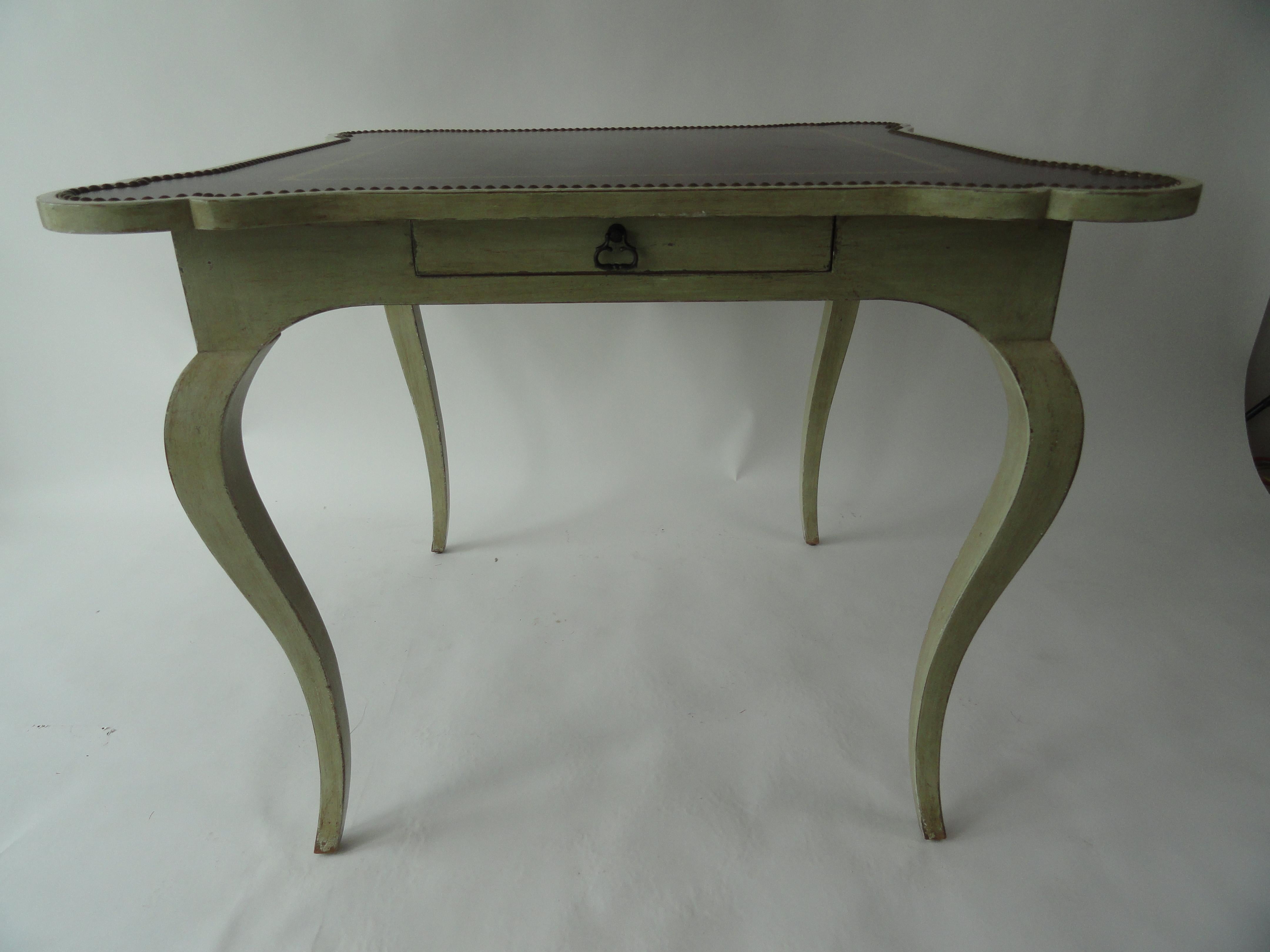 Minton-Spidell game table with drawer. Tooled leather with nailheads on tabletop.