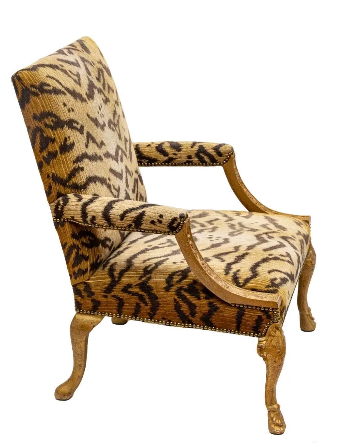 A stunning George II style armchair

By Minton Spidell

USA, Circa Mid 20th Century

Hand carved gilt wood frame, with tiger patterned upholstery

Measures: 29