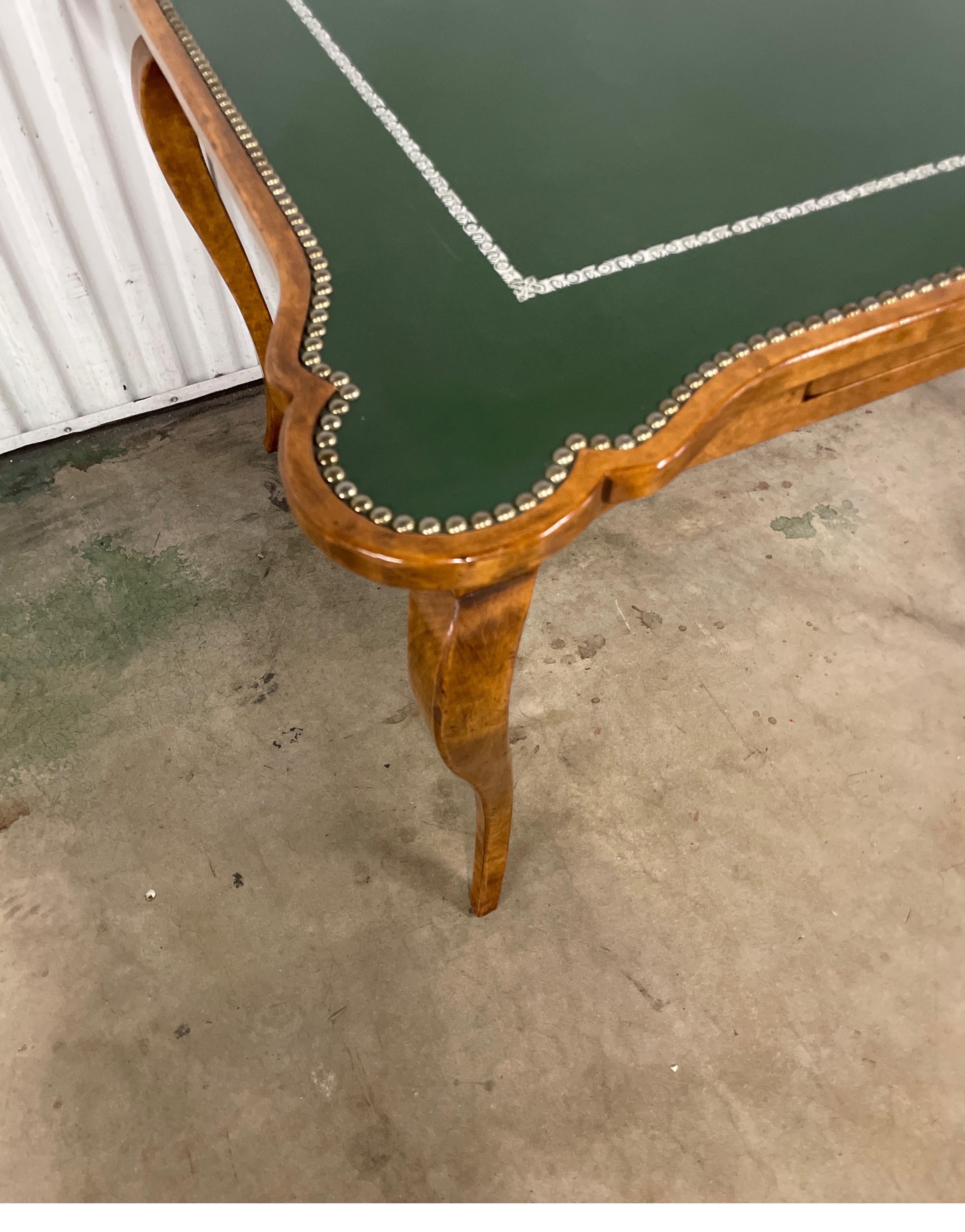 Very fine cabriole leg game table by Minton Spidell. Rich wood finish frame with dark green leather top finished with studs.


