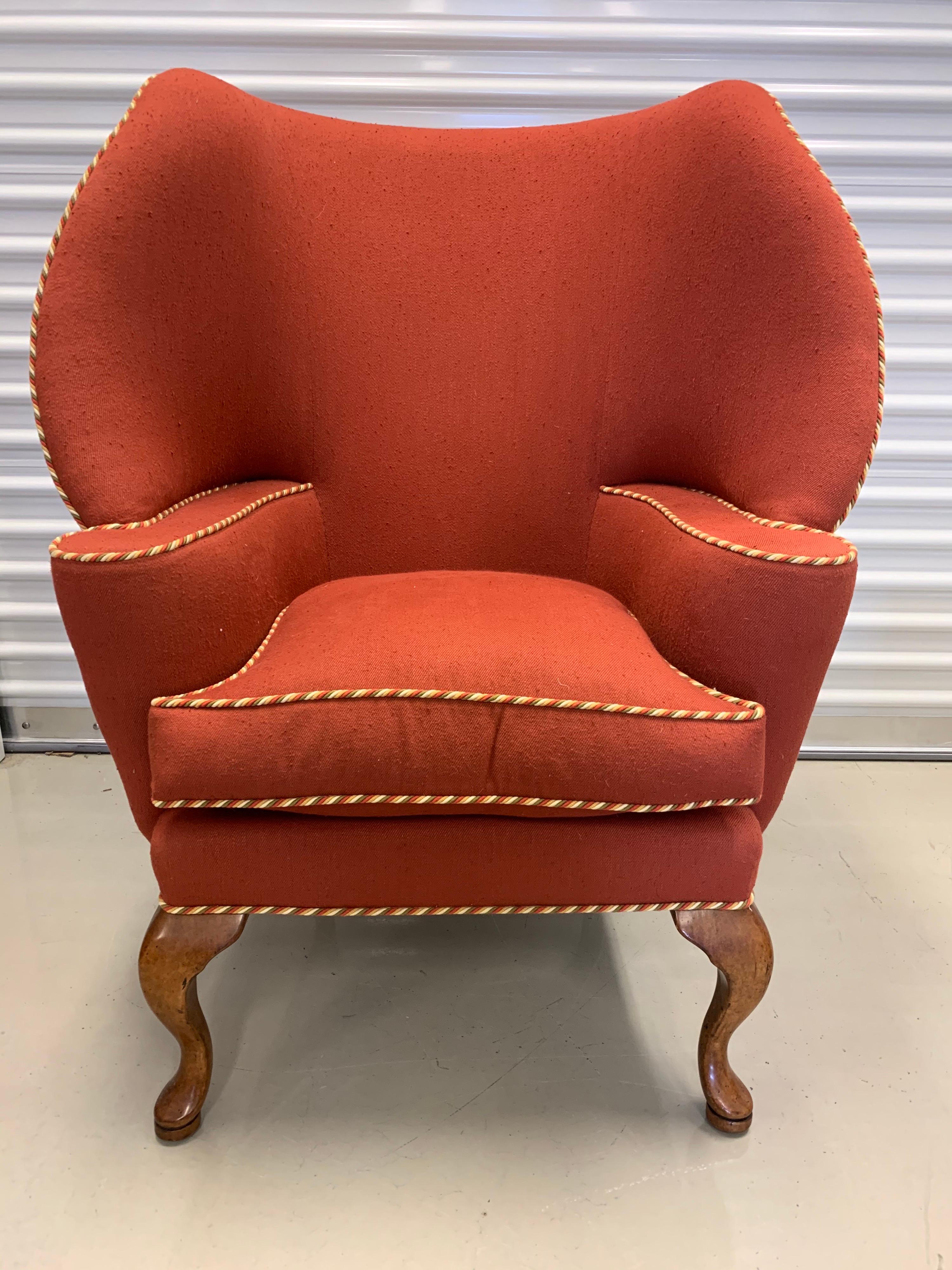With a beautiful curved silhouette, this signed Minton Spidell papa bear upholstered chair will make a grand impression. Fabric is a wool blend and color is best described as a brick red.