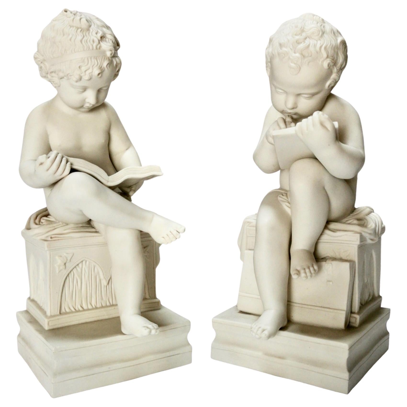 White Parian Figures, L'Enfant Lisant et L'Enfant Écrivant, after Lemire 19thC