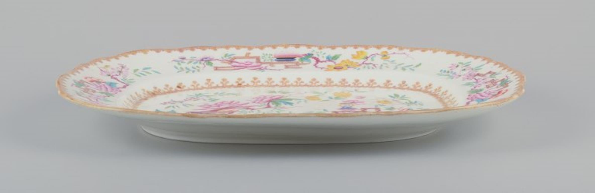 British Mintons, England. Large antique serving platter in faience. Chinese style.