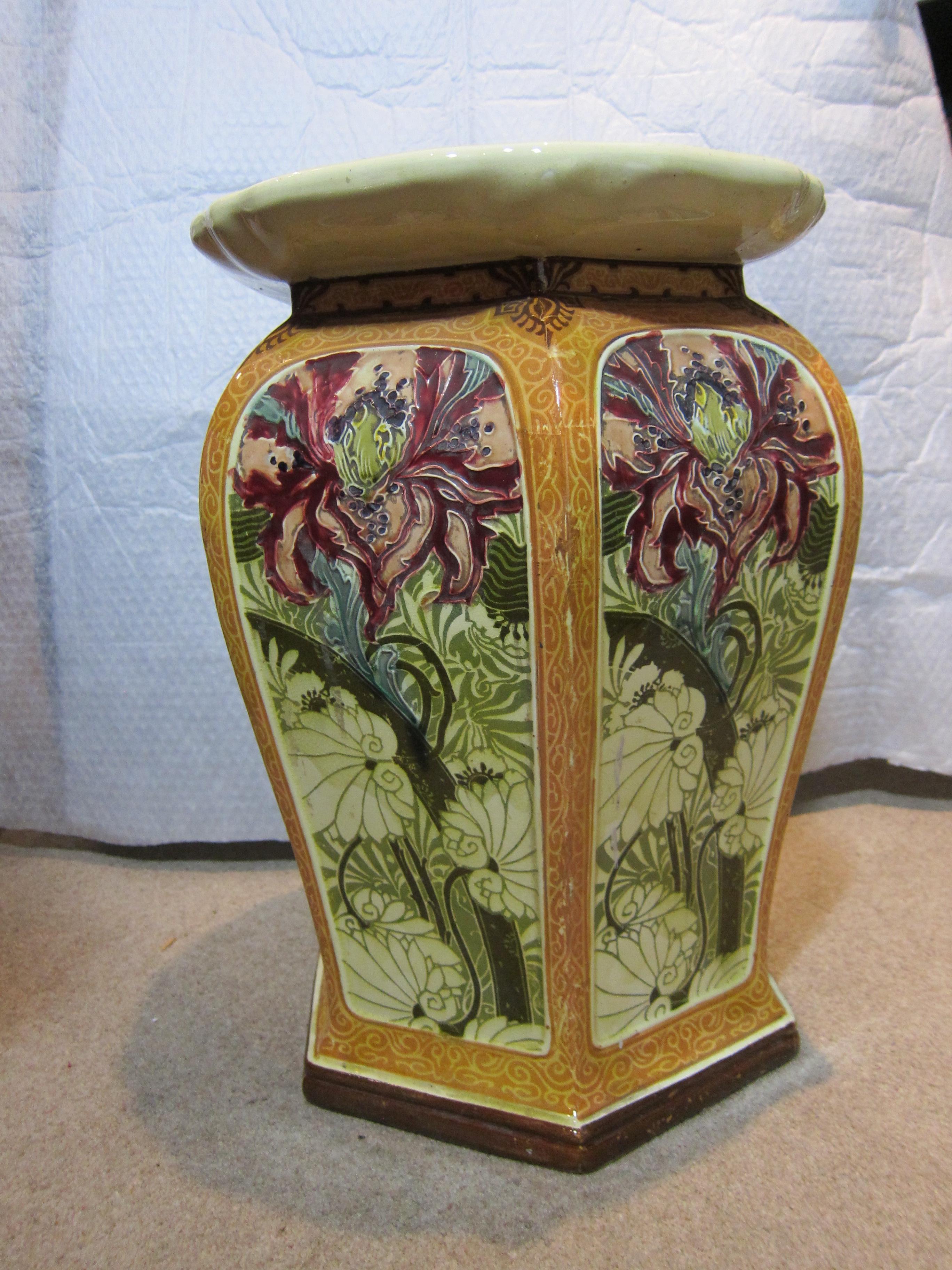 An antique Mintons impressed mark pottery hexagonal garden seat with a floral design on each panel in Secessionist style and a yellow border. Ideal for a small table beside a sofa!