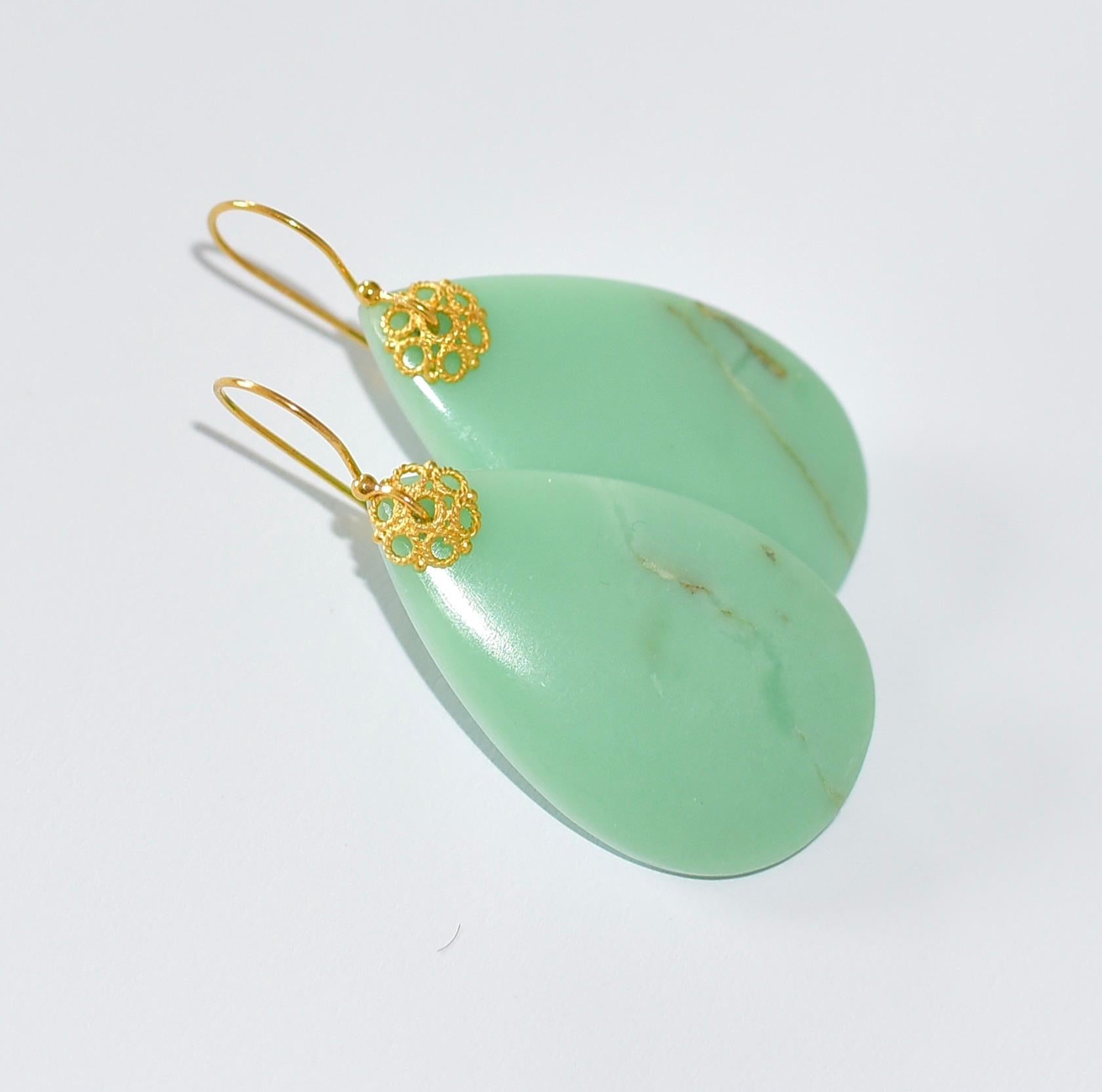 These bold Chrysoprase drops are a semi-opaque pastel minty green in a nice big statement size. They are rounded on both sides measuring a slender 4.5-5mm thick with nice glossy surfaces. They are front drilled at the tips and with just a few minor