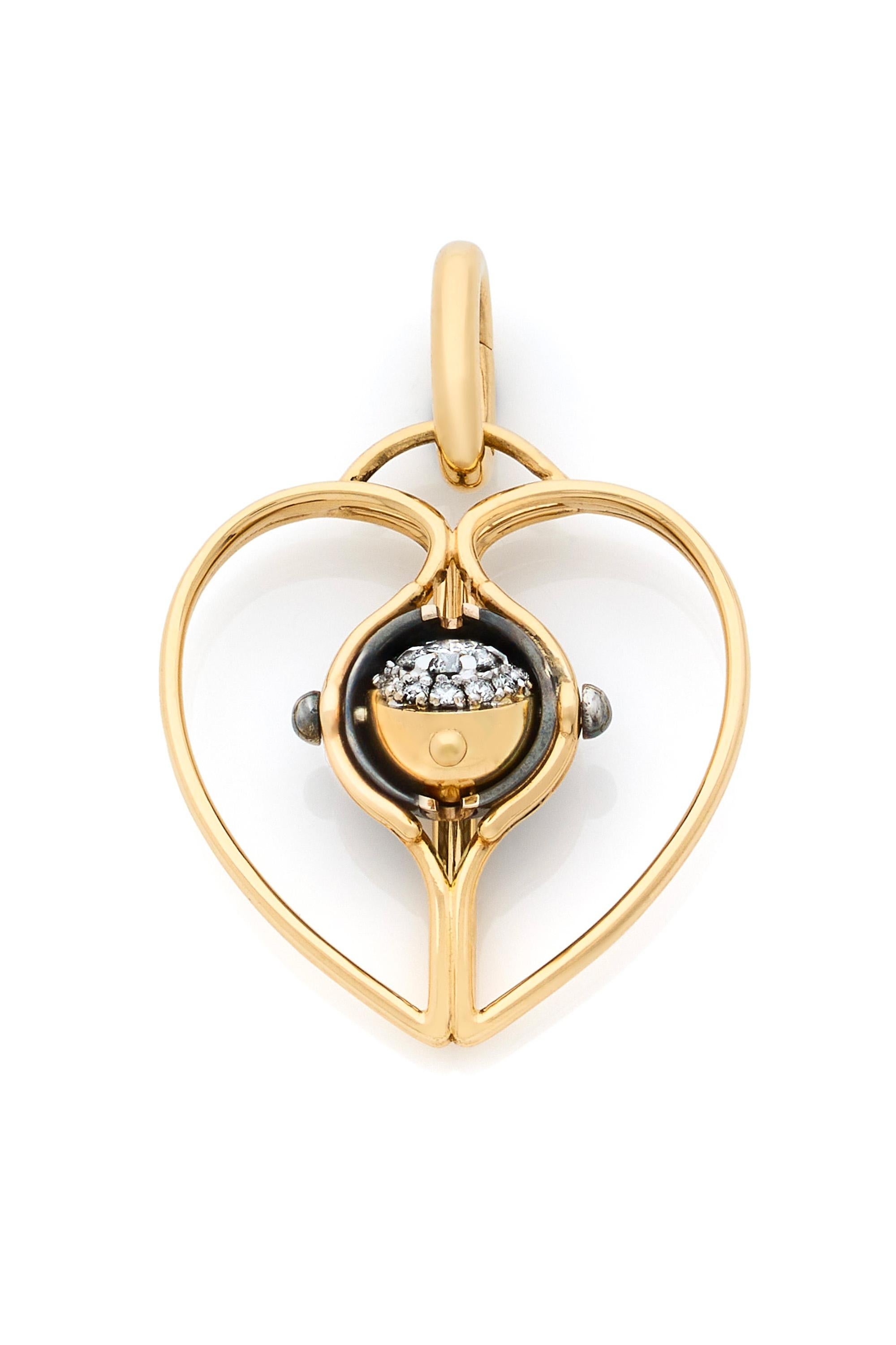 Yellow gold and distressed silver charm. Rotating sphere revealing a diamond  surrounded by white diamonds. Openable gold bail.

Sold without the chain. 

Available with chain on request.

Details:
Central Diamond: 0.23 cts, ø 4mm
12 Diamonds: 0.15
