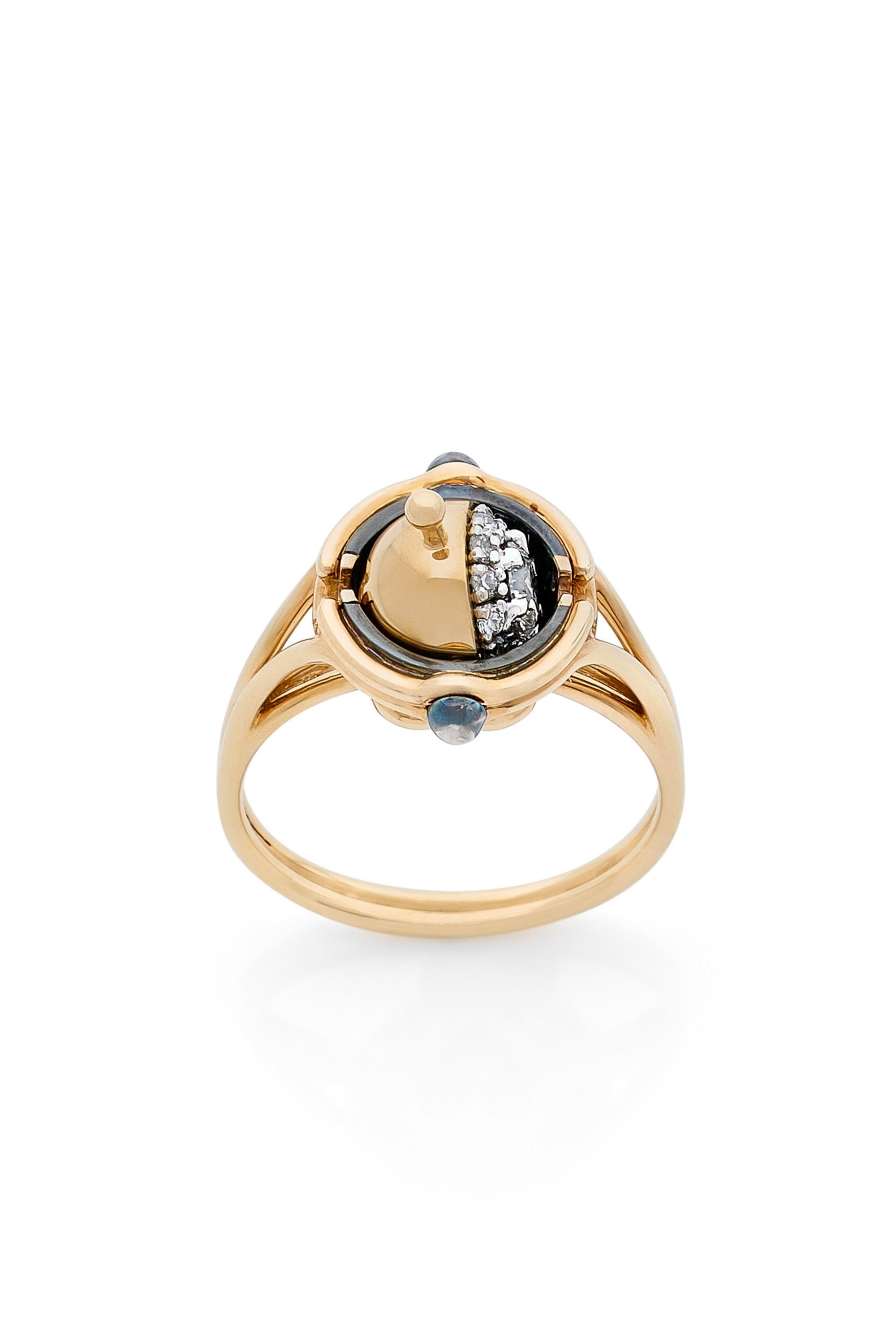 Gold and distressed silver ring. Rotating sphere revealing a diamond surrounded by diamonds.

Available in yellow and white gold.

Details:
Central Diamond: 0.23 cts, ø 4mm
12 Diamonds: 0.15 cts
18k Yellow Gold: 5 g
Distressed Silver: 1.5 g
Made in