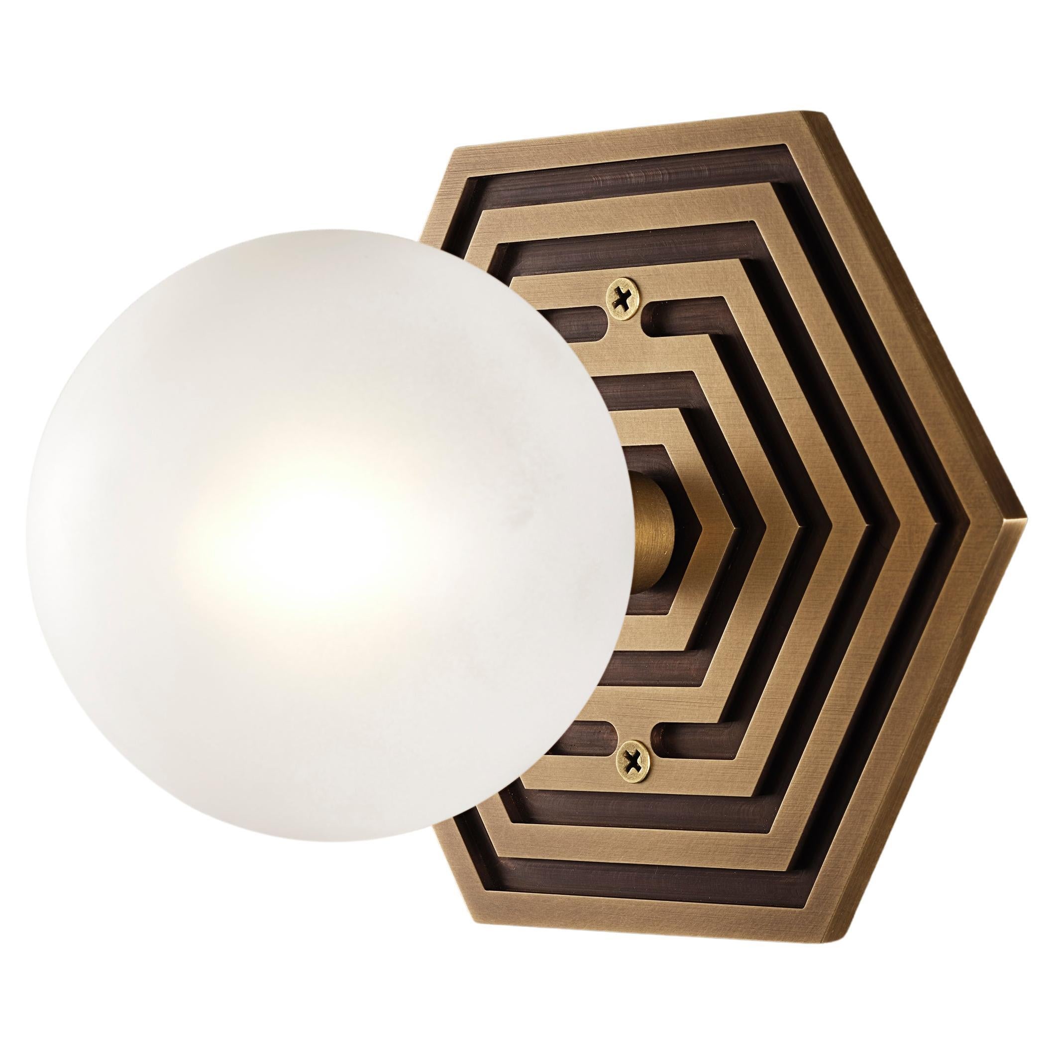 MIRA HEX wall sconce in solid brass and blown opal glass by Blueprint Lighting, 2022.
A handsome study in clean lines and simple form inspired by the both the Machine Age and Art Deco periods, the Mira Hex is truly a go-anywhere design. With its