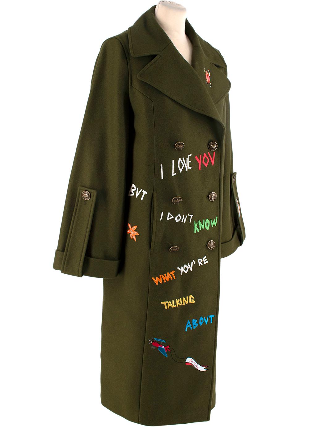 Mira Mikati Khaki Wool Blend Military Embroidered Peacoat

- Khaki wool blend peacoat with playful all-over embroidery motifs
- Boxy fit, large lapels, and military-style large button-up tabs on the cuffs
- Double-breasted design with two welt