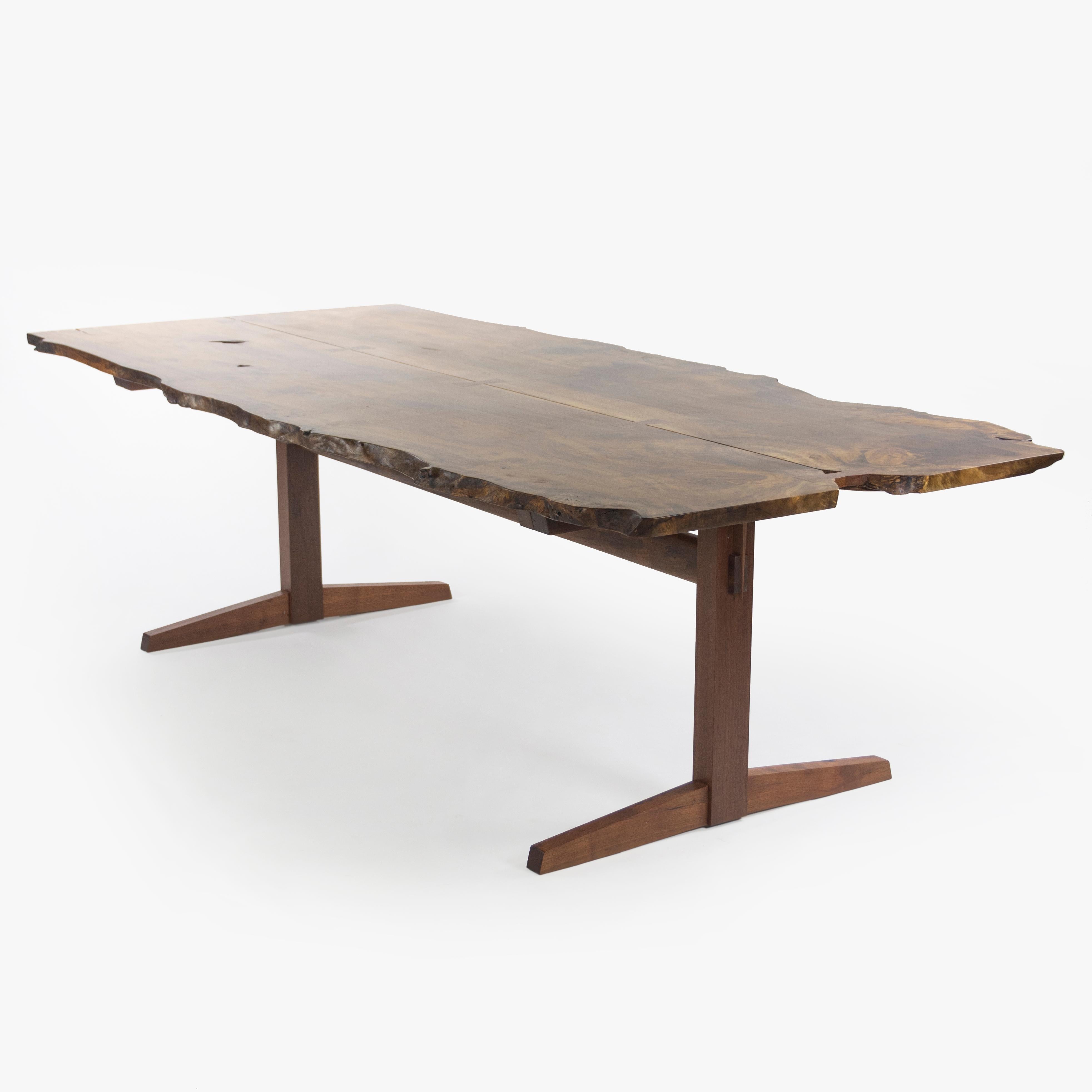 We present this Mira Nakashima trestle dining table with a book-matched Myrtle Burl top, black walnut base, and set of seven rosewood butterflies. This is a monumental work by Mira Nakashima, noting how infrequently burls such as this are used in