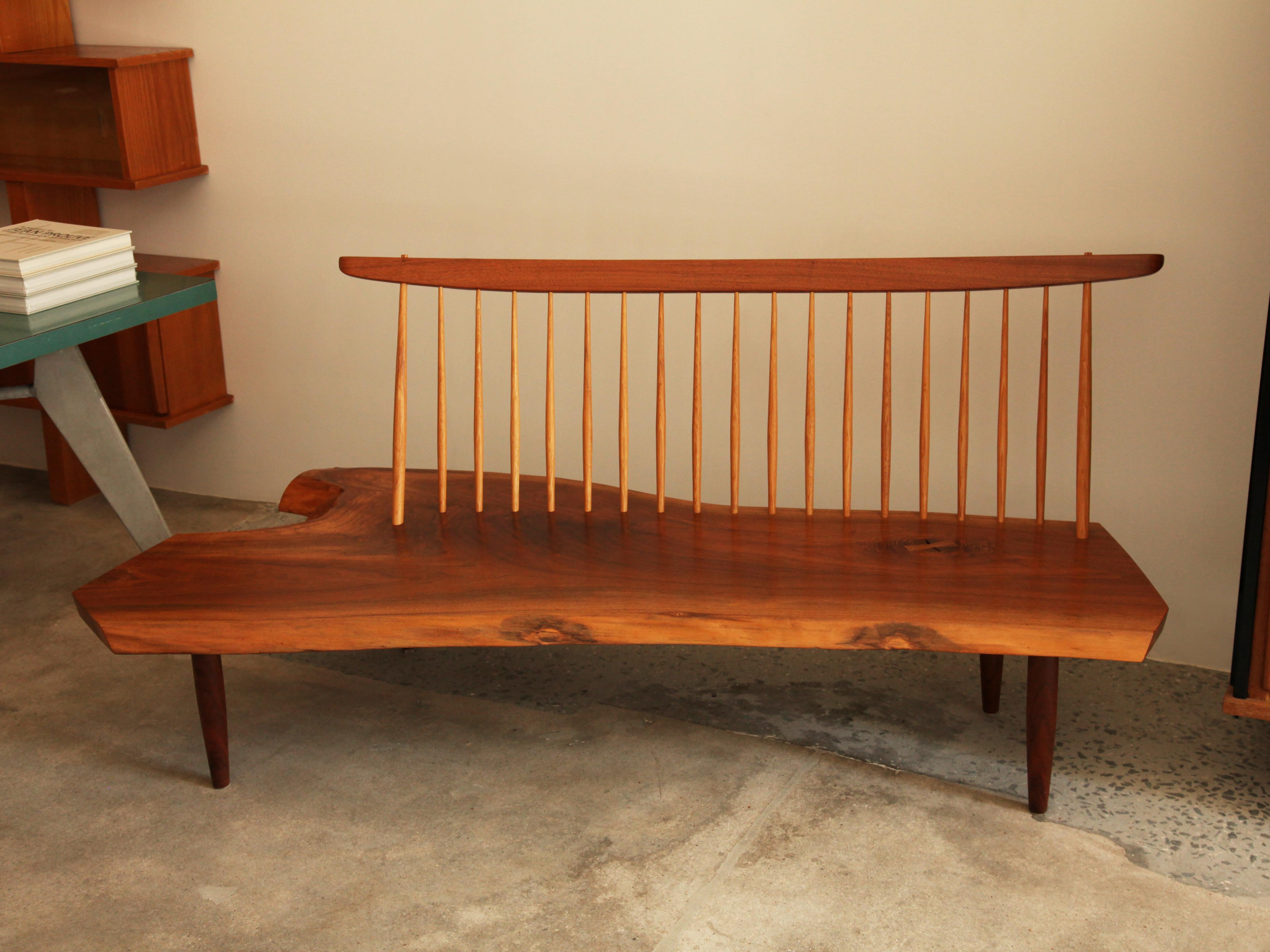 Beautiful Mira Nakashima Conoid bench with back, new hope, Pennsylvania, circa 1992
American black walnut, hickory, laurel
Signed and dated: 