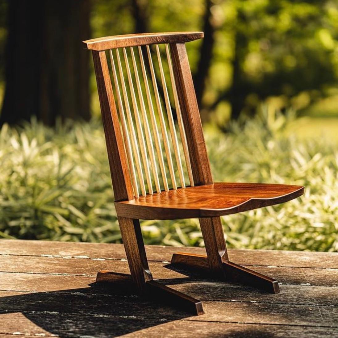 Designed by George Nakashima and executed by Mira Nakashima.

A truly gorgeous piece of craftsmanship, this Conoid lounge chair is perhaps one of the most beautiful pieces we've ever handled. 

The expressive claro walnut seat along with the sublime