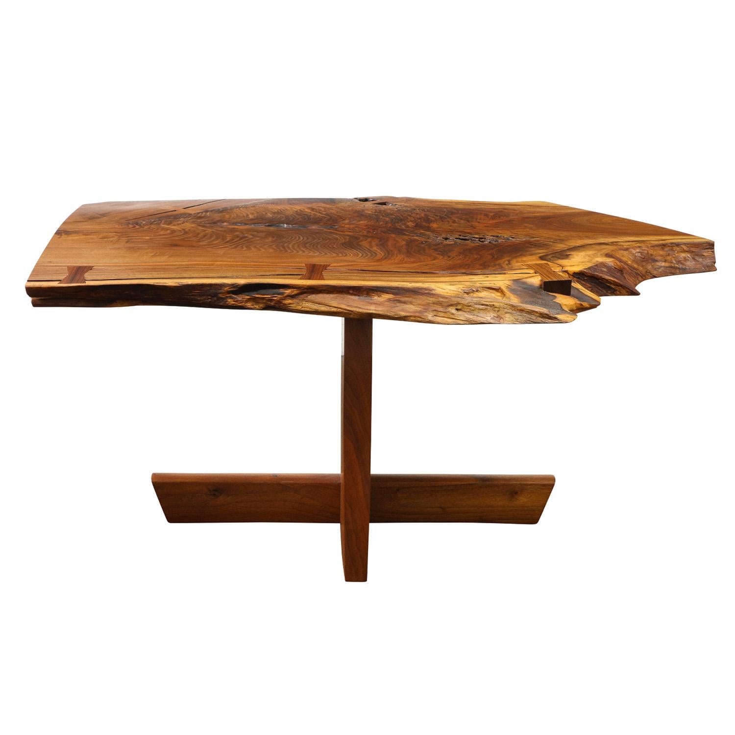 Incredible center/library/hall table with free edge design in black walnut with rosewood butterflies by Mira Nakashima, American 2007 (signed and dated on bottom “Mira Nakashima 8.9.07”). The free edge is on a sap edge and this slab itself is very