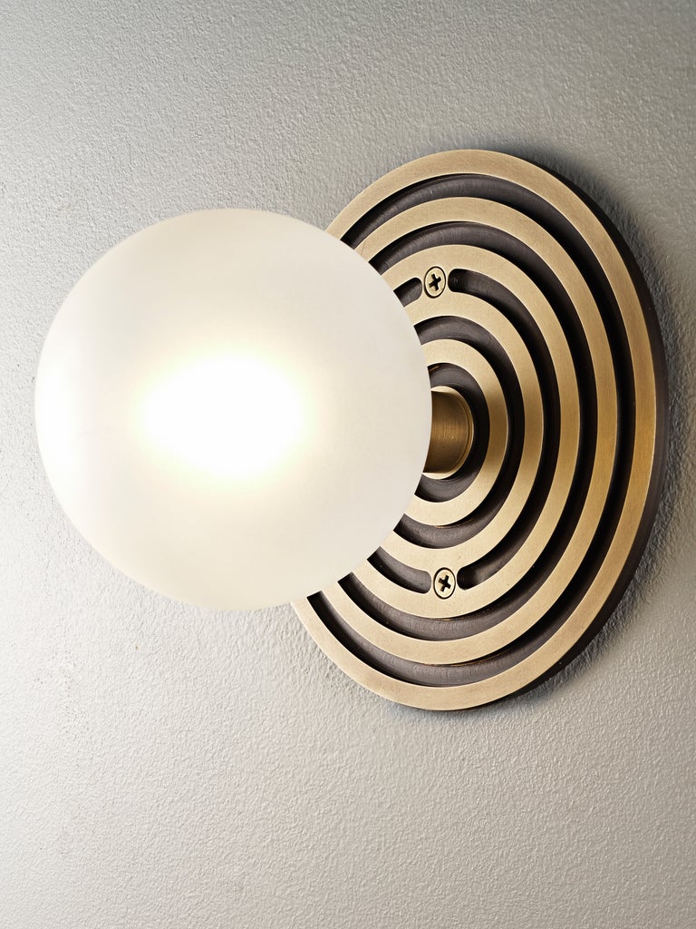 Mira Round wall sconce in brass and blown opal glass by Blueprint Lighting, 2022.
A handsome study in clean lines and simple form inspired by both the Machine Age and Art Deco periods, the Mira Round is truly a go-anywhere design. With its