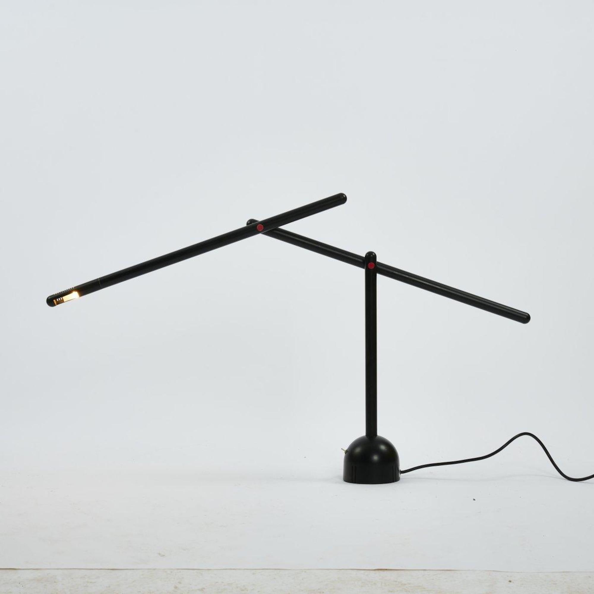 Mira table lights are a work realized by Mario Arnaboldi in 1983.

H. 119 cm (max.). Made by Programmaluce, Milan.

Metal tube, enameled black, plastic, red, aluminum head

Marked: designer and manufacturer's label.

Ref. Fiell, 1000 Lights, Vol. 2,