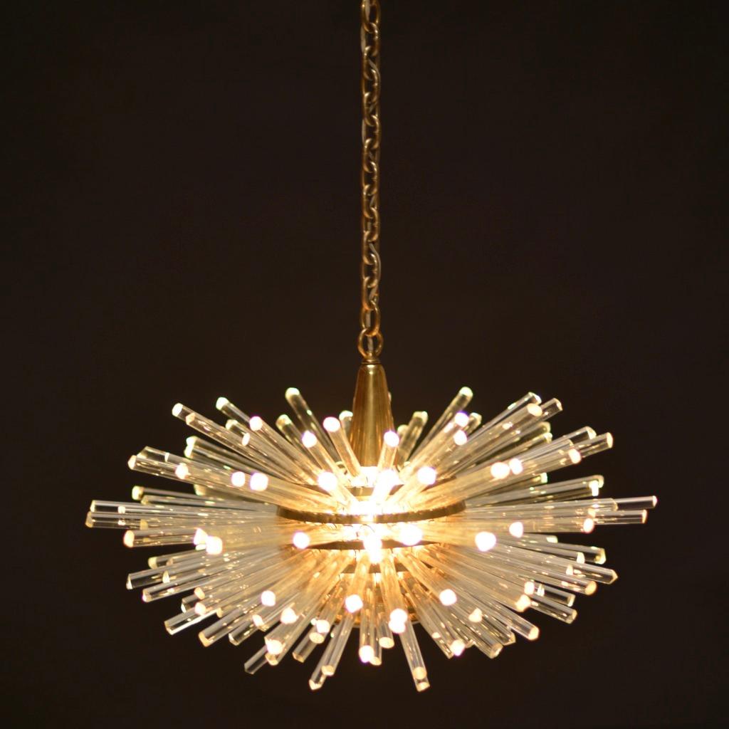 Miracle chandelier designed by Prof. Friedl Bakalowits for Bakalowits & Söhne
This Sputnik crystal glass and brass chandelier was made in Austria, manufactured in the 1960s.
The layered multi-tier structure is made of solid brass rings and glass