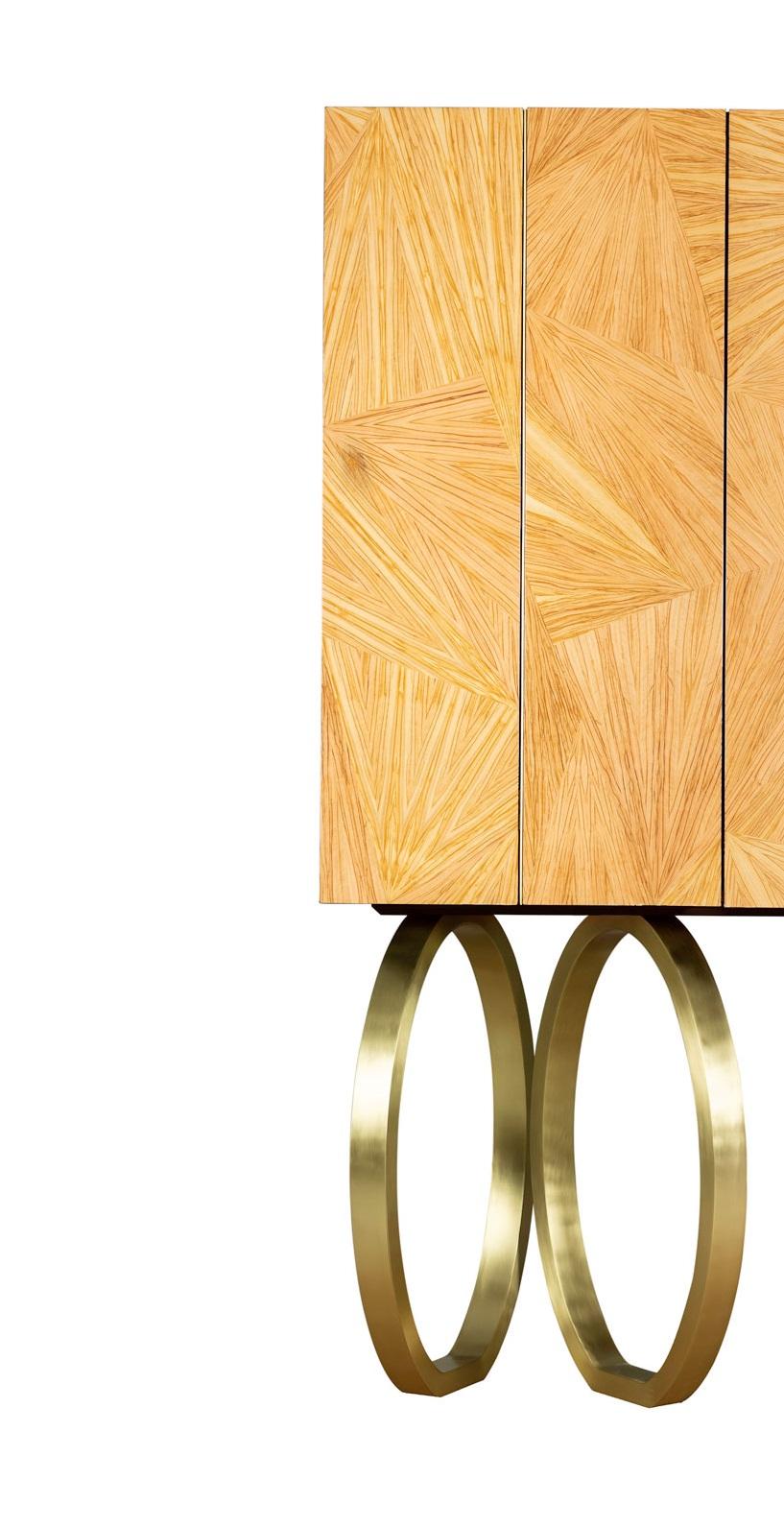 Mirage Bar Cabinet by Memoir Essence
Dimensions: D 50 x W 90 x H 165 cm.
Materials: Brushed brass, olive veneer patchwork and lacquer.

Also available in polished brass and olive veneer without patchwork. Please contact us.

Inspired by the optical