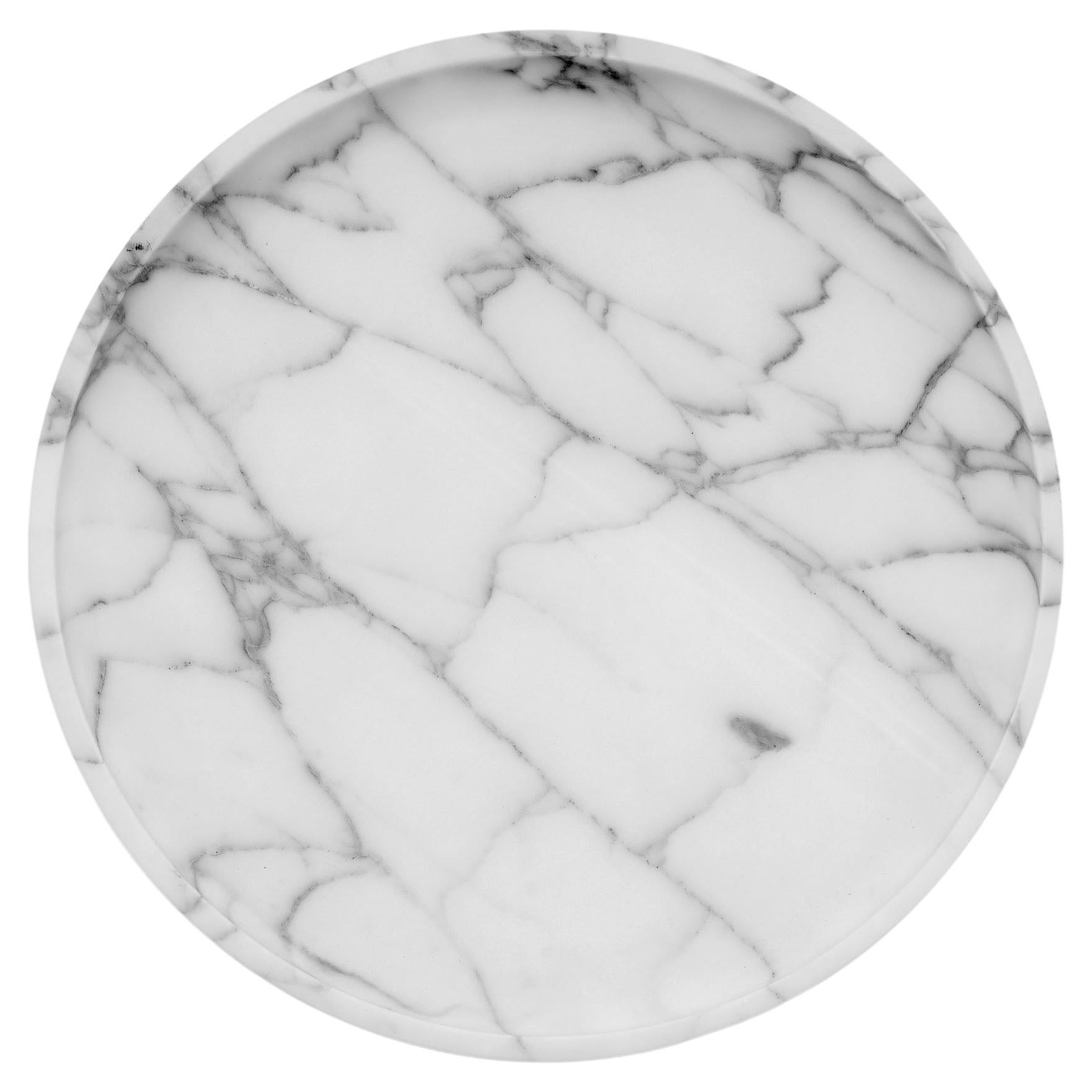 Mirage Contenitore Basso by Studio Intervallo
Dimensions: D 30 x H 3.2 cm
Materials: white Arabescato marble.
Available in other stones.

The Mirage collection comes from the monolithic materiality of stone. Shape and function coincide,