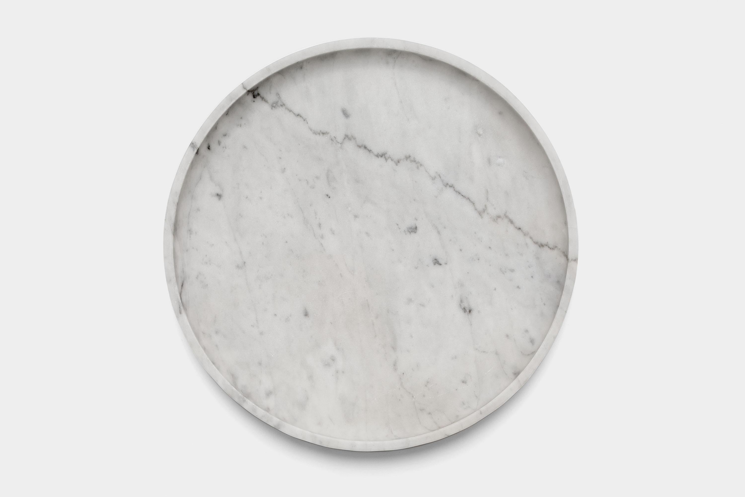 Mirage Contenitore basso by Studio Intervallo
Dimensions: D 30 x H 3.2 cm
Materials: marble,
Available in other stones.

The Mirage collection comes from the monolithic materiality of stone. Shape and function coincide, creating an element