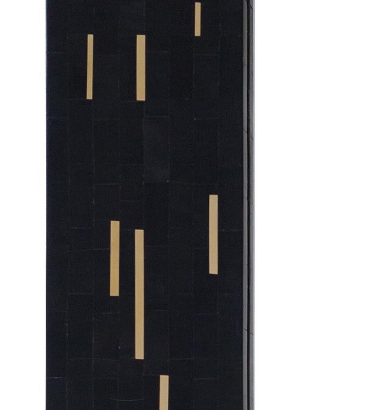 This mirror frame is made of Horn, wood and brass. Brass inlays of random widths and lengths are inlayed on the black horn bringing in a sense drama and movement. These brass inlays can be customized to form any pattern.
Mirror choices include