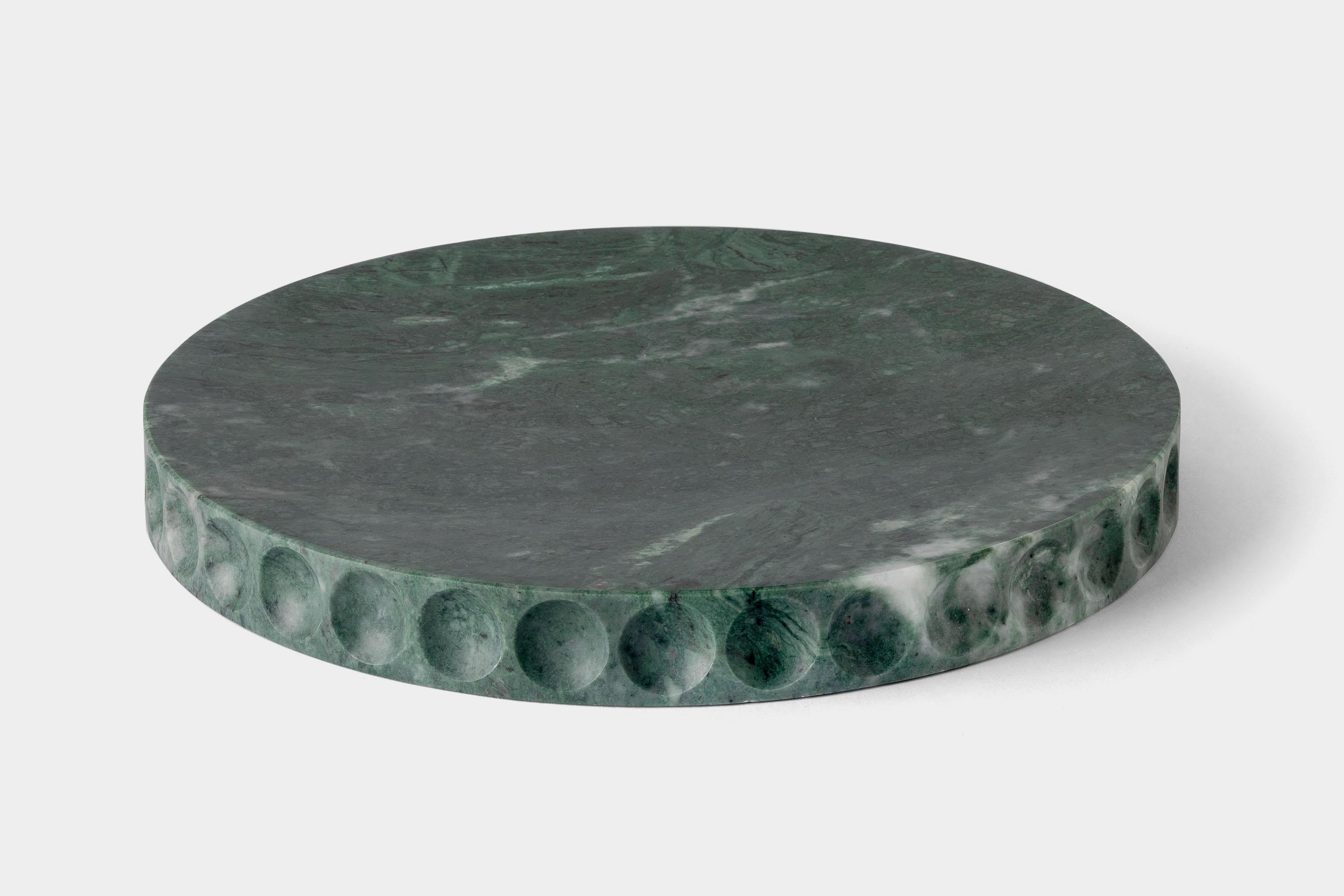 Mirage Lente by Studio Intervallo
Dimensions: D 30 x H 3.2 cm
Materials: green Guatemala marble.
Available in other stones.

The Mirage collection comes from the monolithic materiality of stone. Shape and function coincide, creating an element