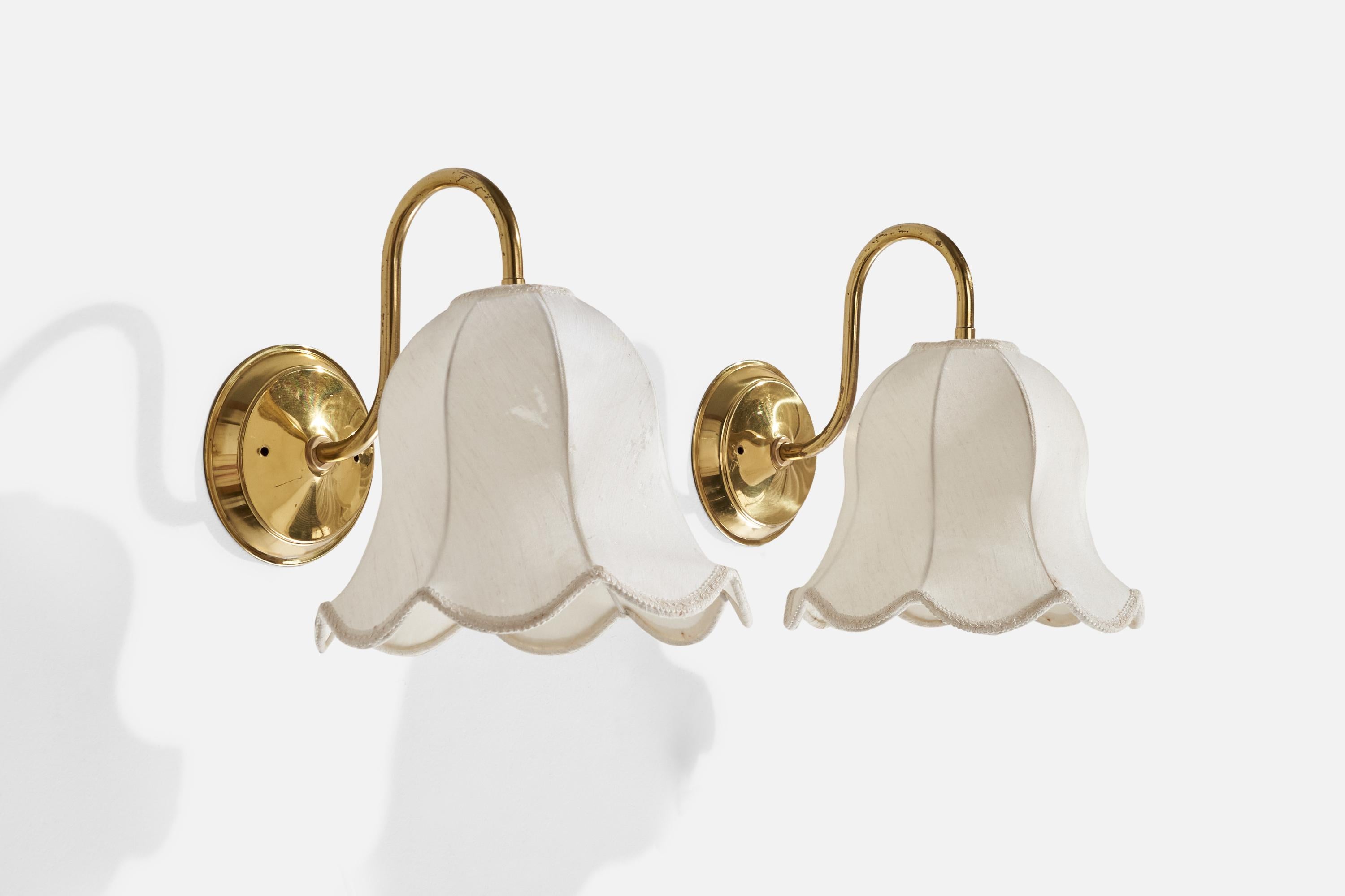 A pair of brass and fabric wall lights designed and produced by Miranda AB, Sweden, c. 1970s.

Overall Dimensions (inches): 12” H x 10” W x 12.25” D
Back Plate Dimensions (inches): 5.50” H x 0.69” D
Bulb Specifications: E-26 Bulb
Number of Sockets: