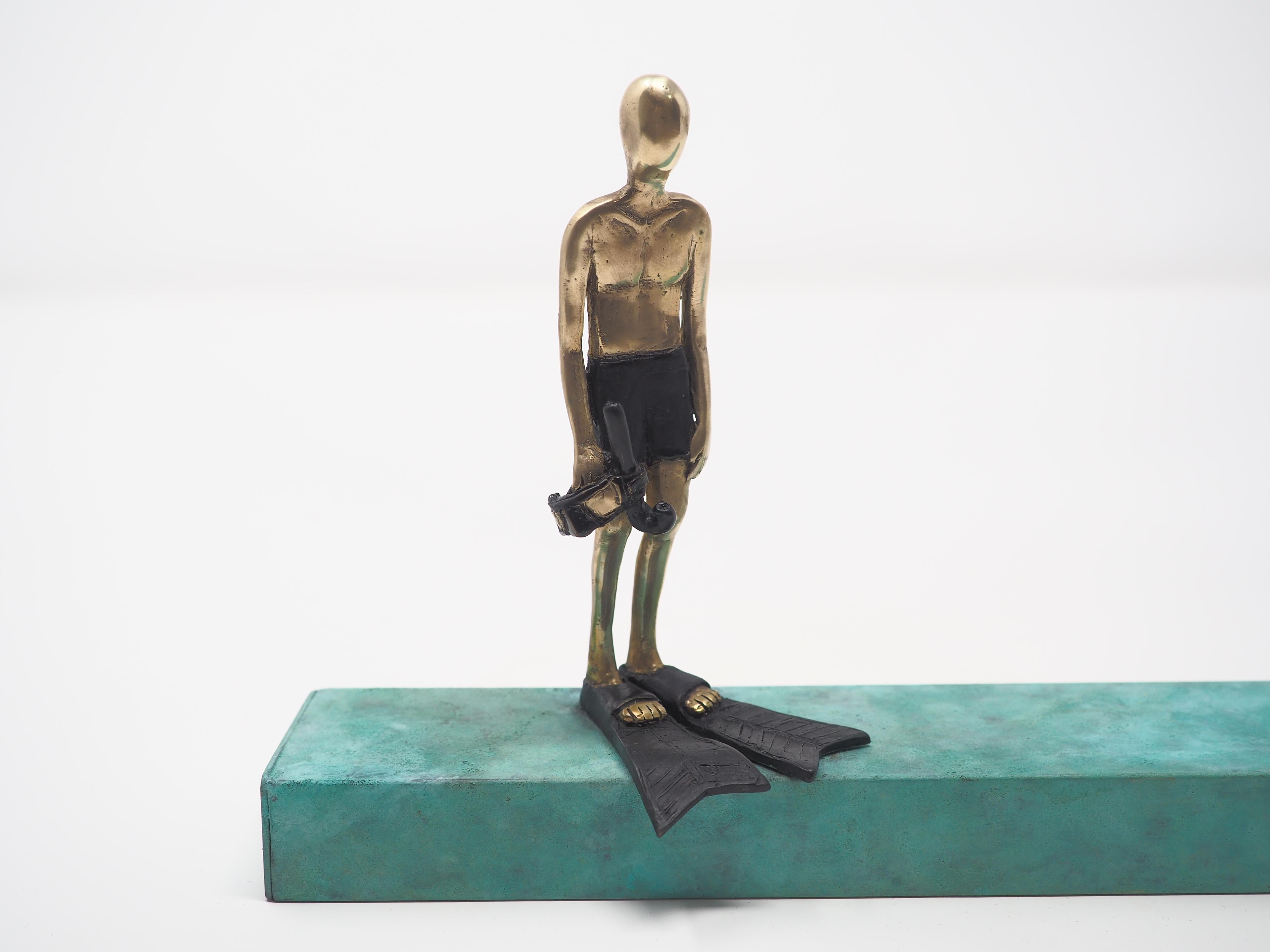 Before the dive- bronze and brass small figurative man mural sculpture  - Contemporary Sculpture by Mireia Serra