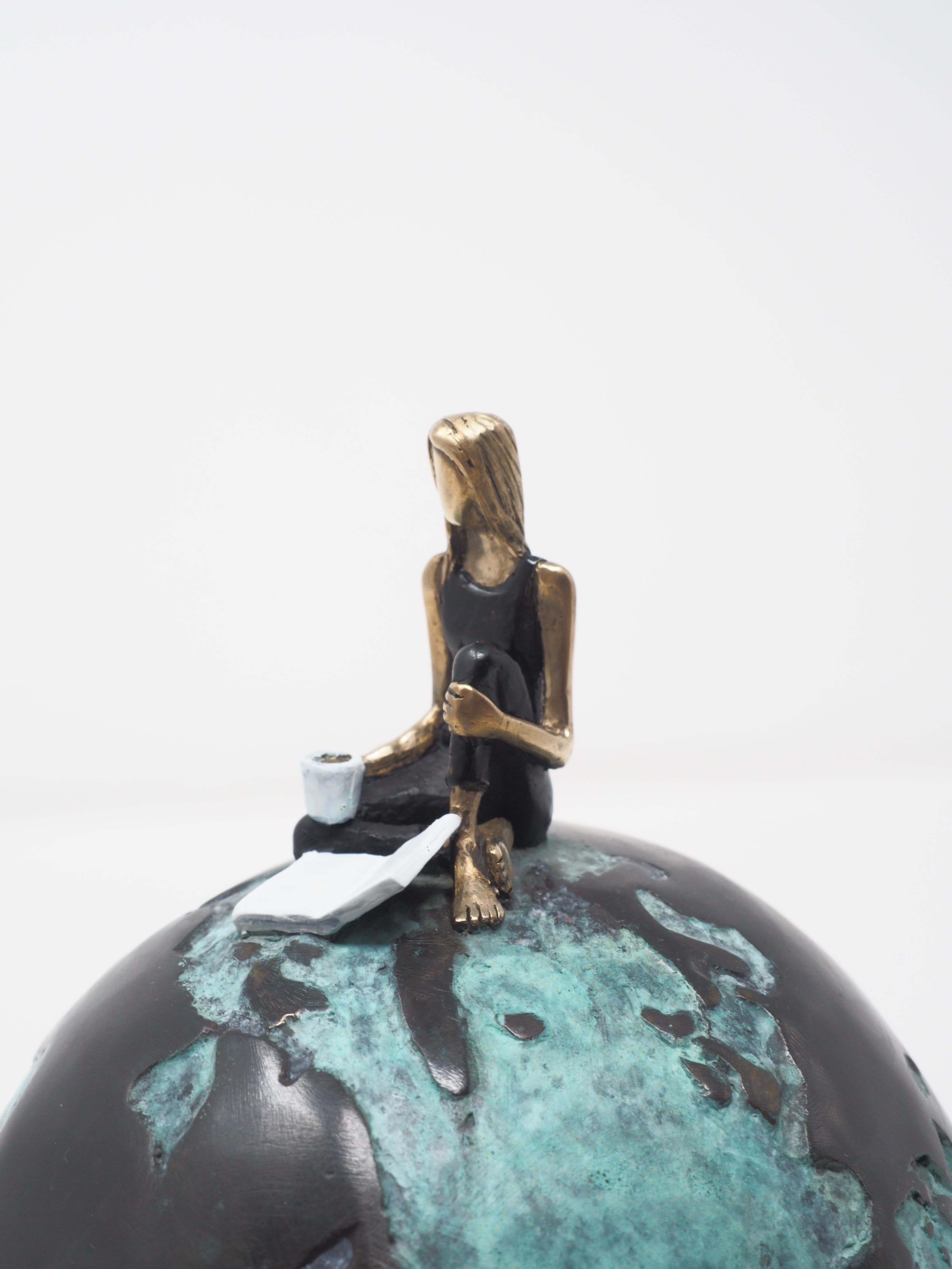 Globe- contemporary figurative bronze sculpture of a woman and a book on a globe - Sculpture by Mireia Serra