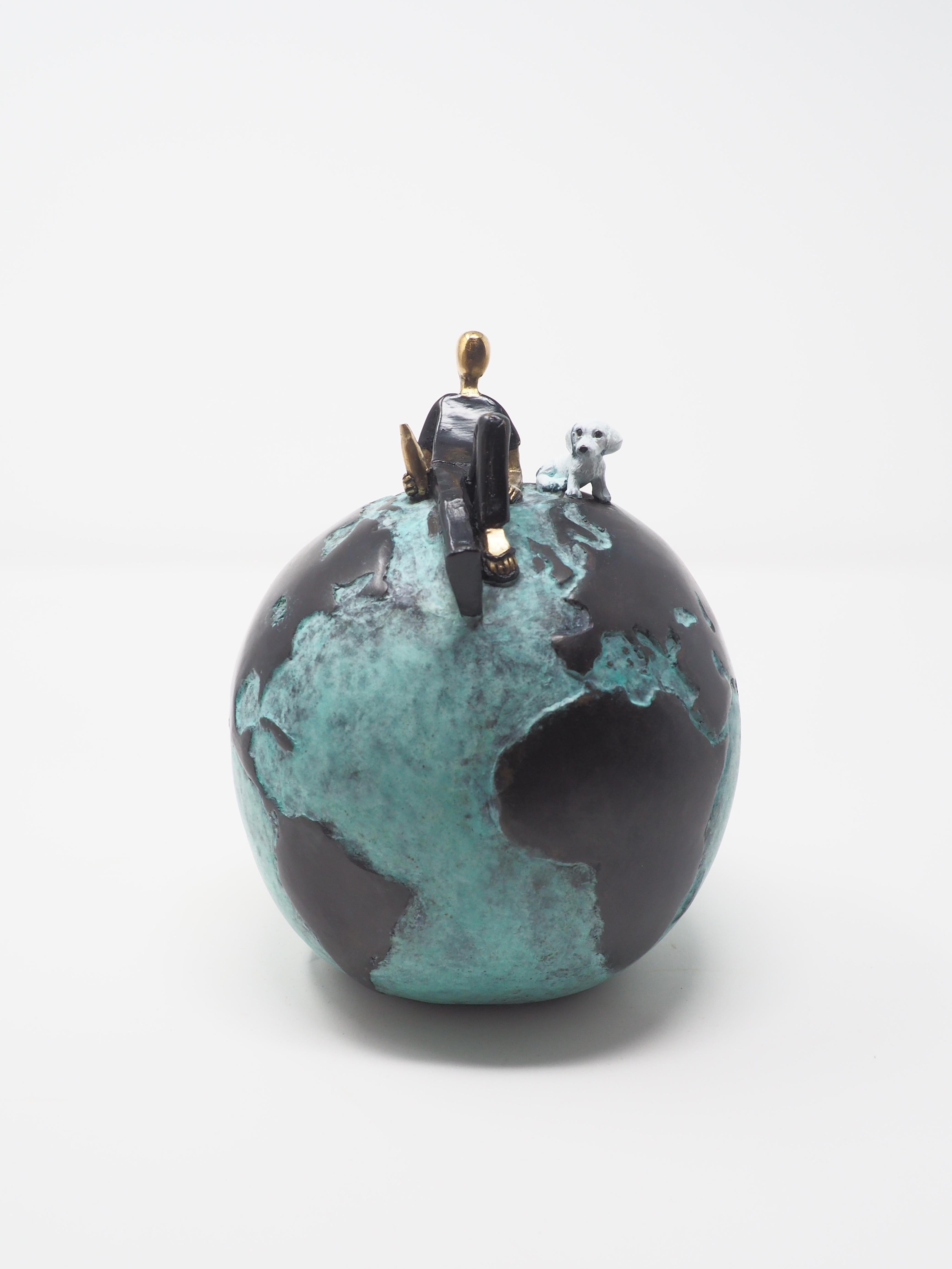Mireia Serra Figurative Sculpture - Laid back- figurative bronze sculpture of a man with a dog on a globe