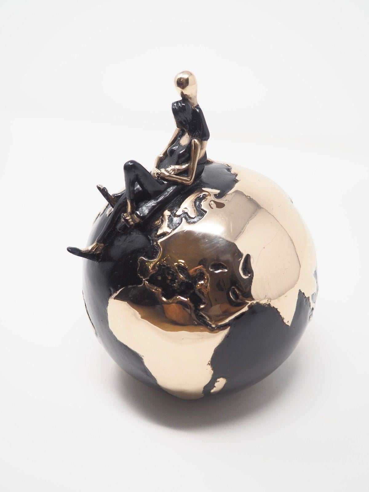Love her Madly- Standby your loved one, enjoy the time being together. This Gold edition of Mireia is made of bronze with black patina (the ocean) and polished bronze that gives the shiny gold appearance (the continents).  Edition Size: 8 + 4 Artist