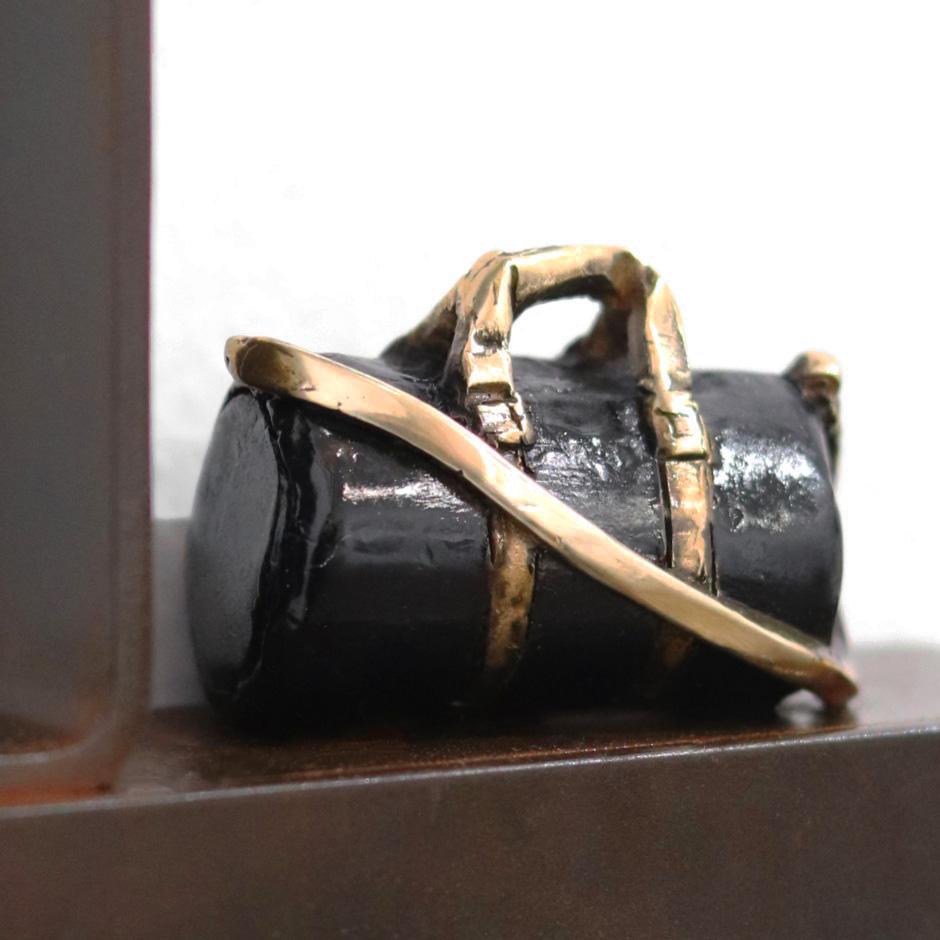 Travel Light - Figurative Bronze Inspiring Iron Metal Wall Sculpture - Gold Figurative Sculpture by Mireia Serra