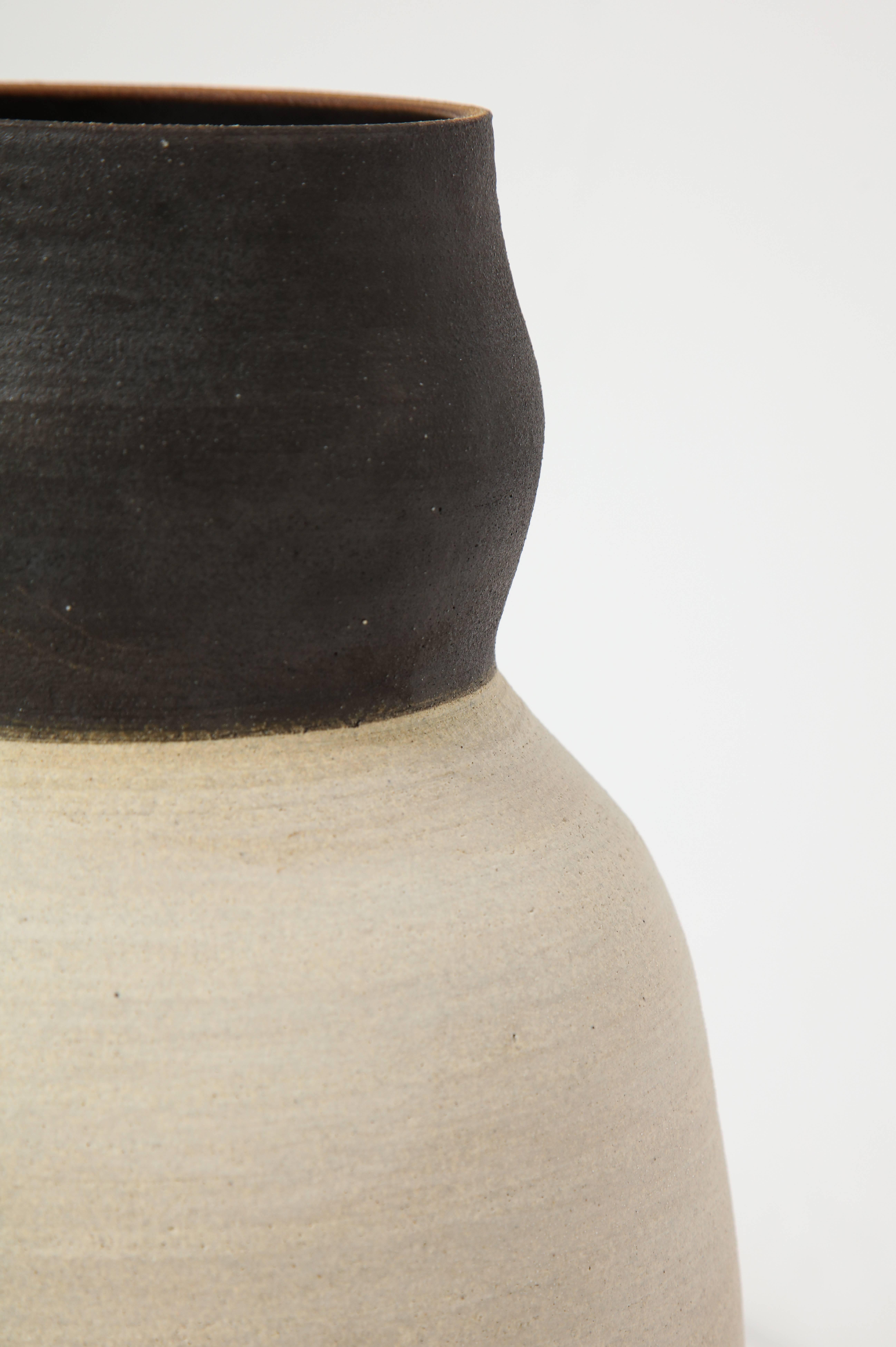 Stoneware. Matte ecru and black.

Stands 14