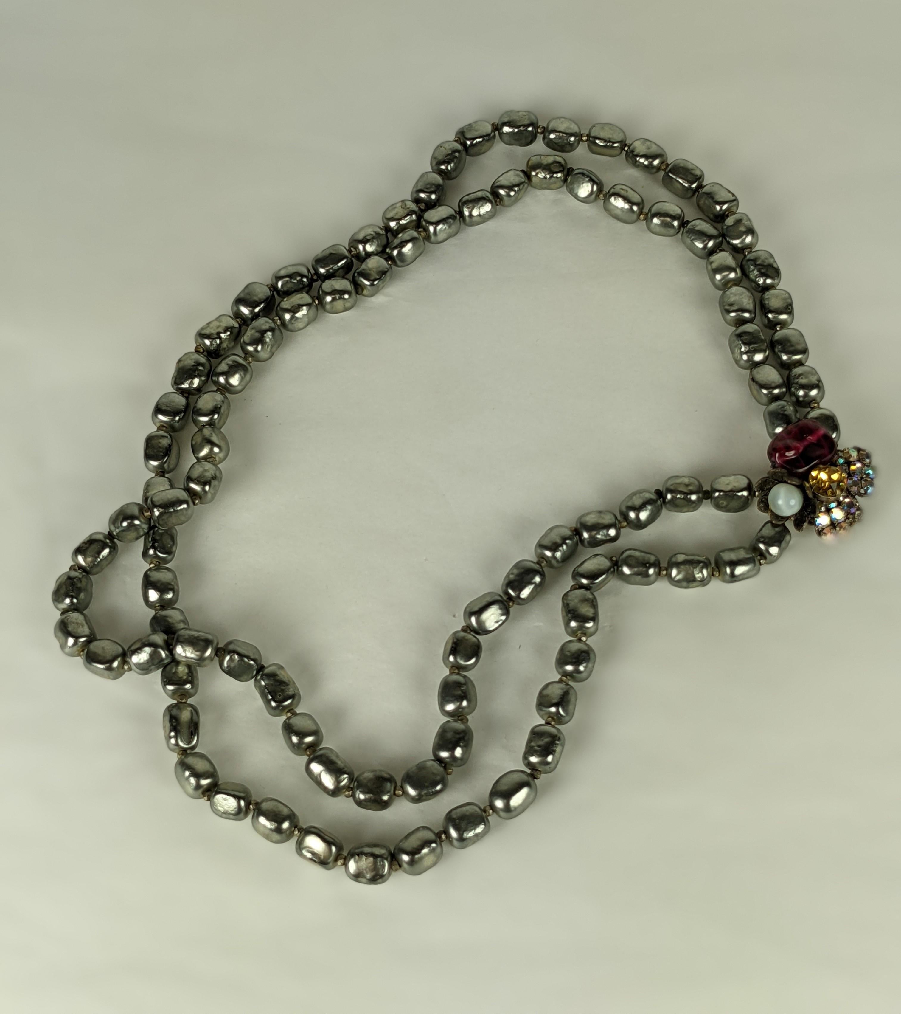 Miriam Haskell 2 Strand Unusual Faux Grey Baroque Pearls with elaborate clasp with ruby bead, citrine paste and aurora pastes. Signed.  1950's USA.
22