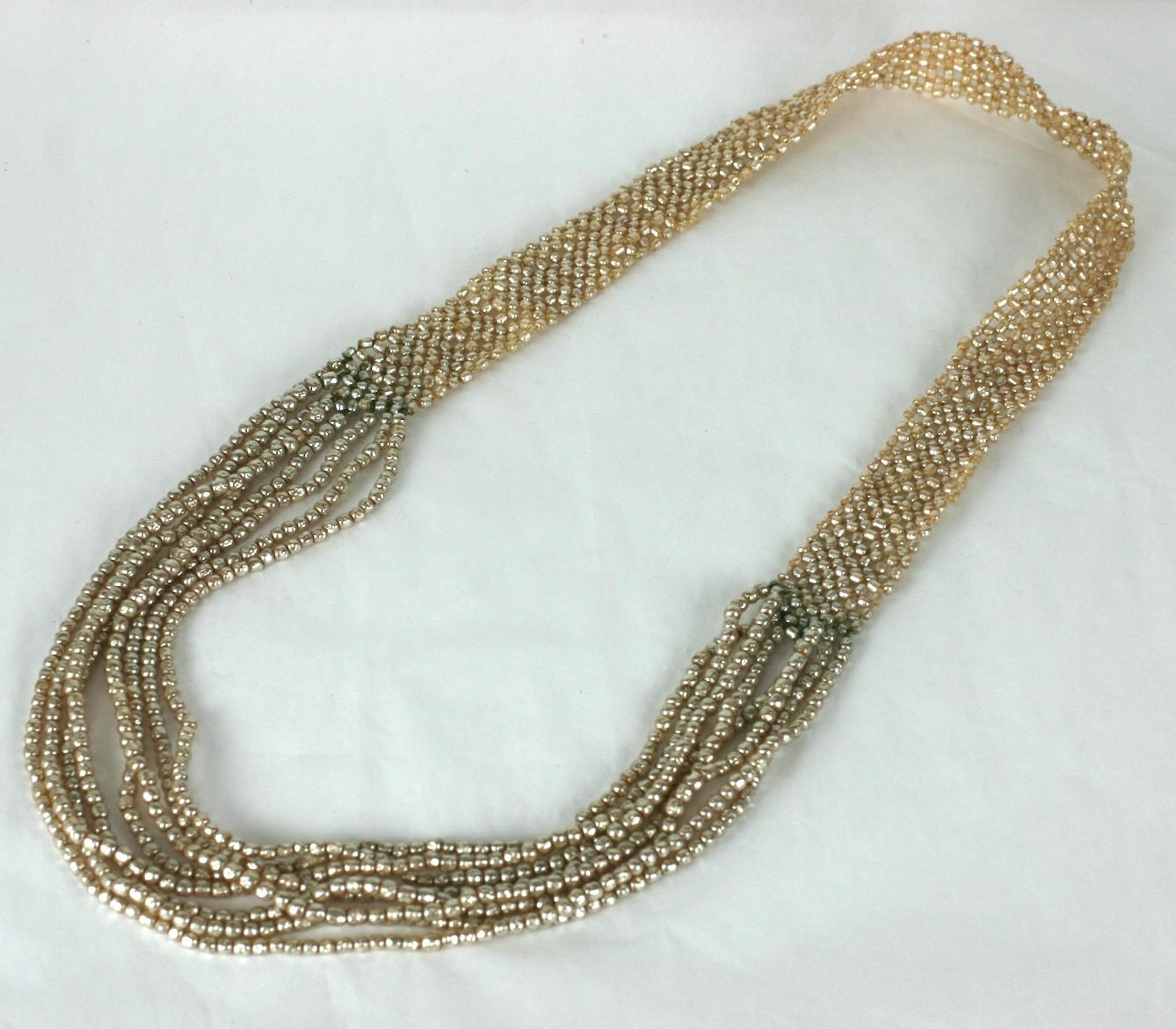 Amazing and rare Miriam Haskell necklace of woven signature baroque faux pearls. The overall basket woven pattern terminates in draped multi strands of baroque faux pearls. 
Excellent Condition, 1940's USA. 
Woven area 1