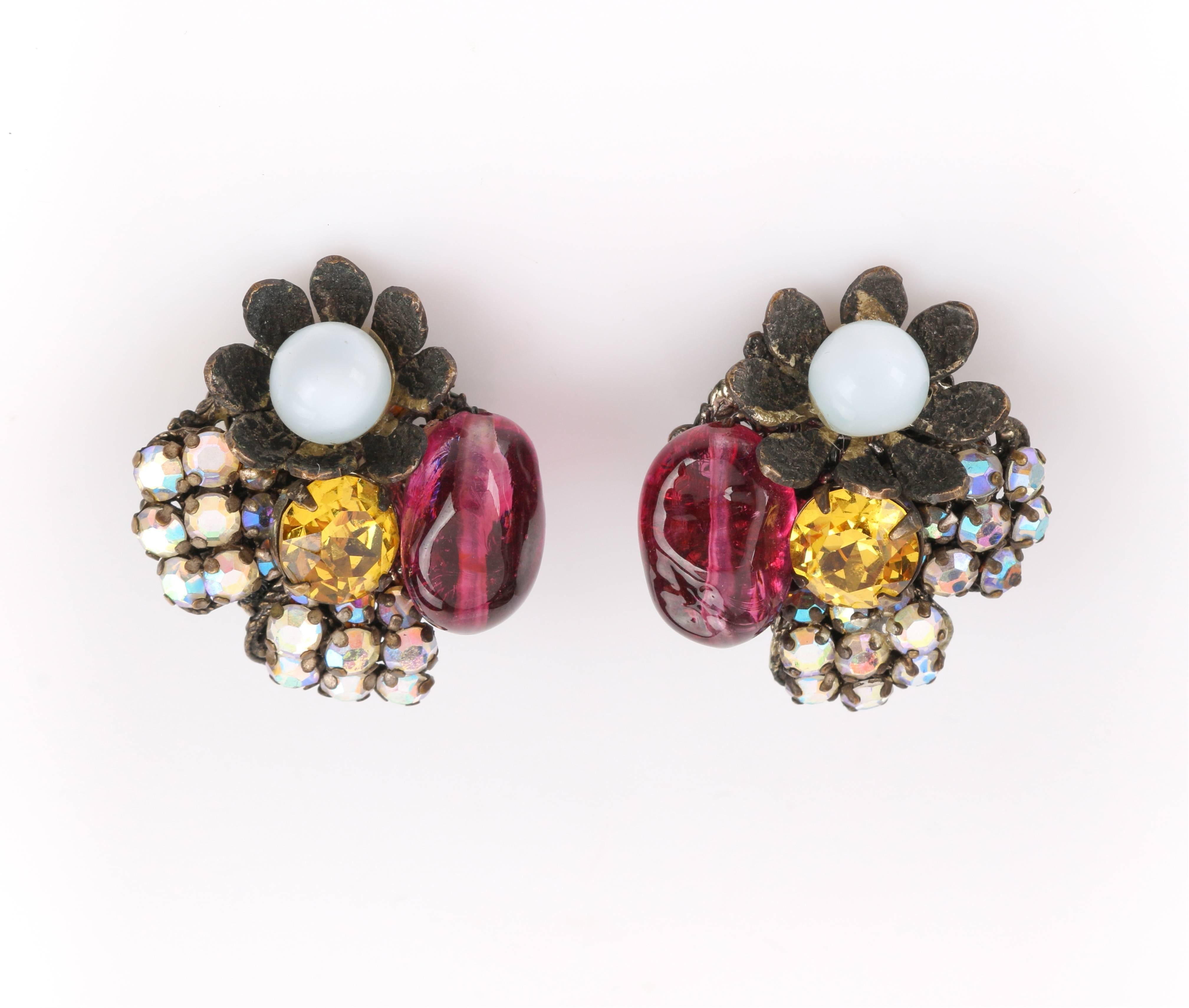 Vintage Miriam Haskell c.1950's glass bead and crystal rhinestone clip-on cluster earrings. Designed by Frank Hess. Brass-toned curved petal flower with white glass spherical bead center, two aurora borealis crystal rhinestone clusters, and pink