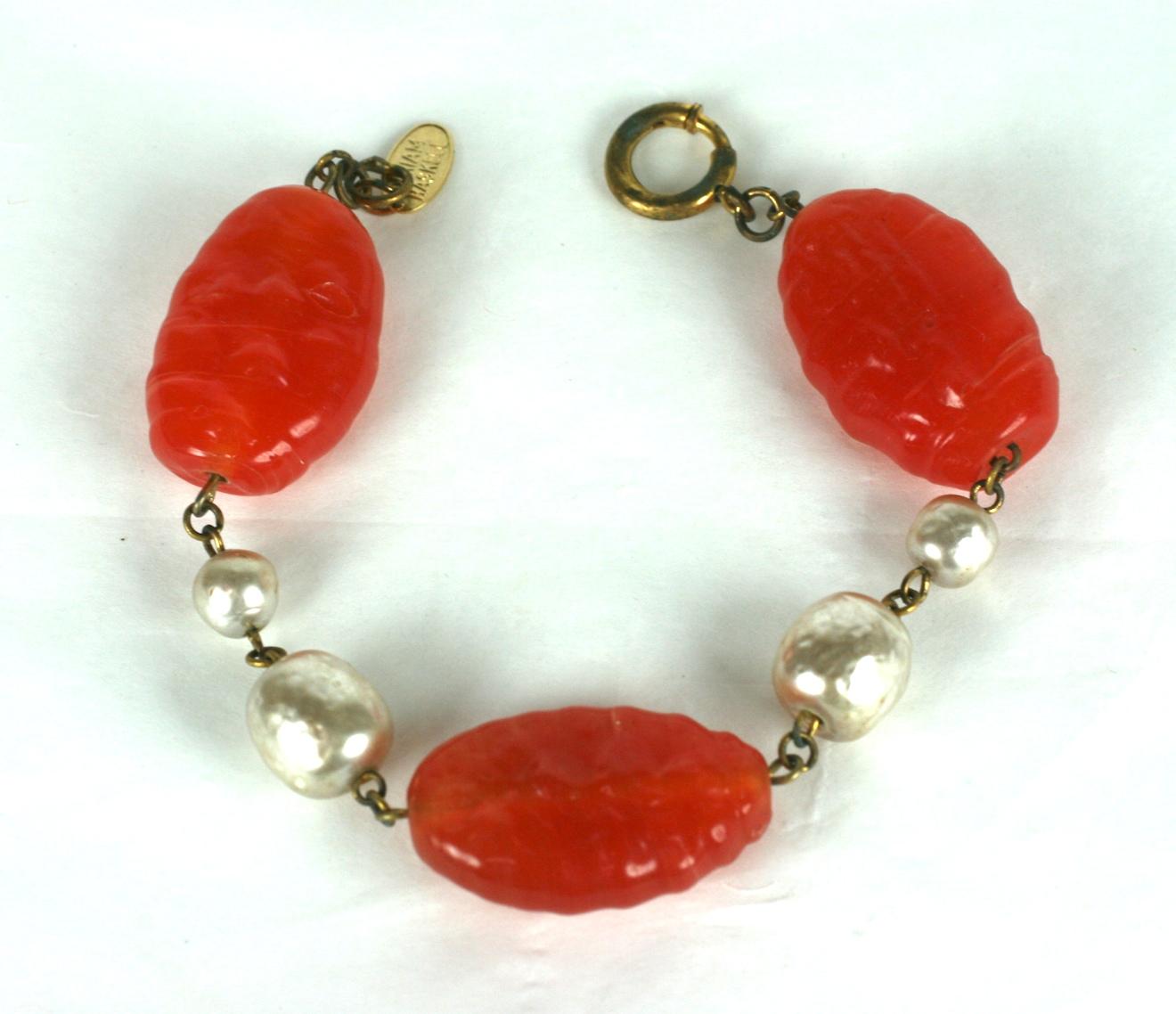 Miriam Haskell pate de verre and faux baroque pearl bracelet composed of three oversized faux carnelian handmade  Gripoix glass beads and two stations of large and medium alternating Miriam Haskell signature faux pearls.
 Excellent Condition,